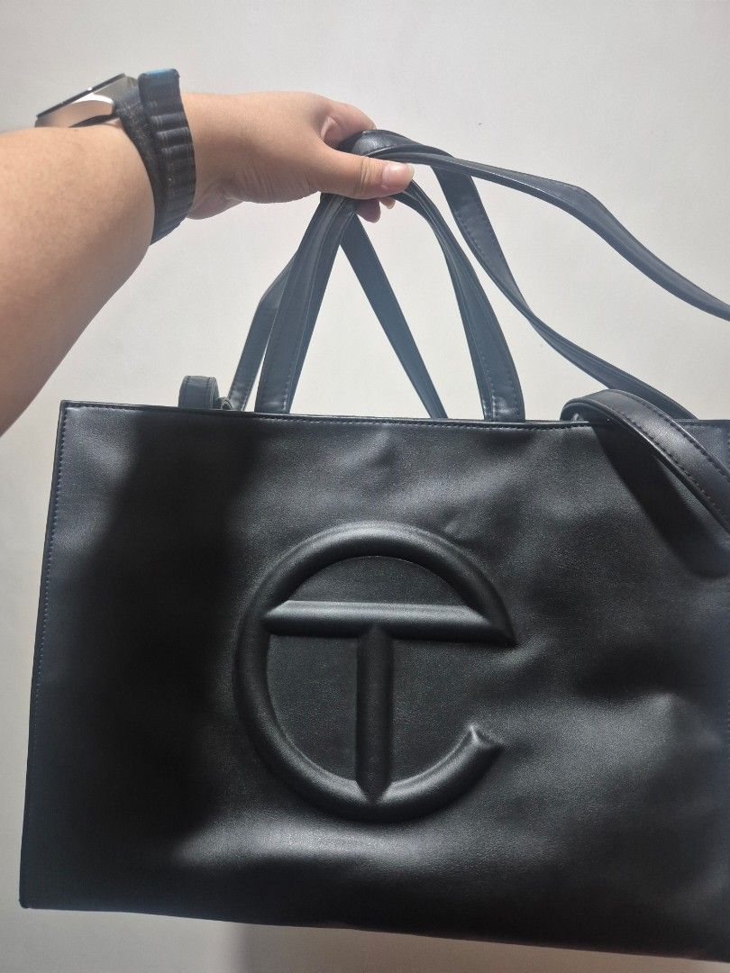 Telfar Medium Black Shopping Bag (Category: Tote Bags) located in Cainta. Submitted by jamdgu (Listing ID 1420477681, Image 1). Description: Telfar Medium Shopping Bag (Black) With dust bag Lightly used, no flaws Bought from pasabuy MOP: Maya, GCash, BPI, UnionBank, GoTyme Delivery: J&T, Lalamove Loc: Cainta.