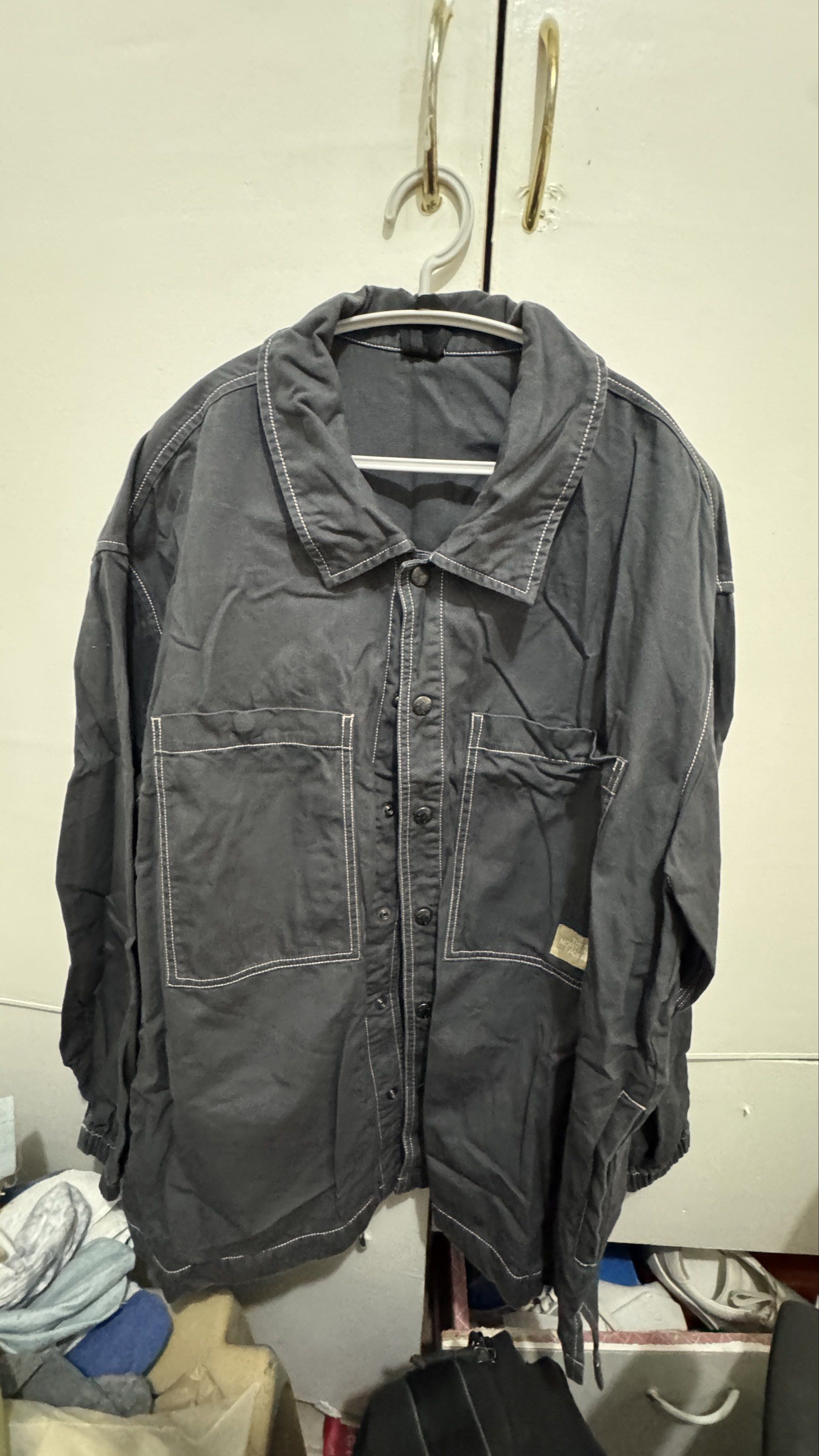 The North Face Jacket XL (Category: Coats, Jackets and Outerwear) located in Manila. Submitted by offthehype (Listing ID 1420428734, Image 1). Description: - The North Face jacket - Color: Dark Grey - Size: XL/105 - Button-up front - Two front pockets - White stitching details - Elastic cuffs - The North Face logo (front and back) - Thick denim like fabric Price is negotiable Good for overshirt or layering.