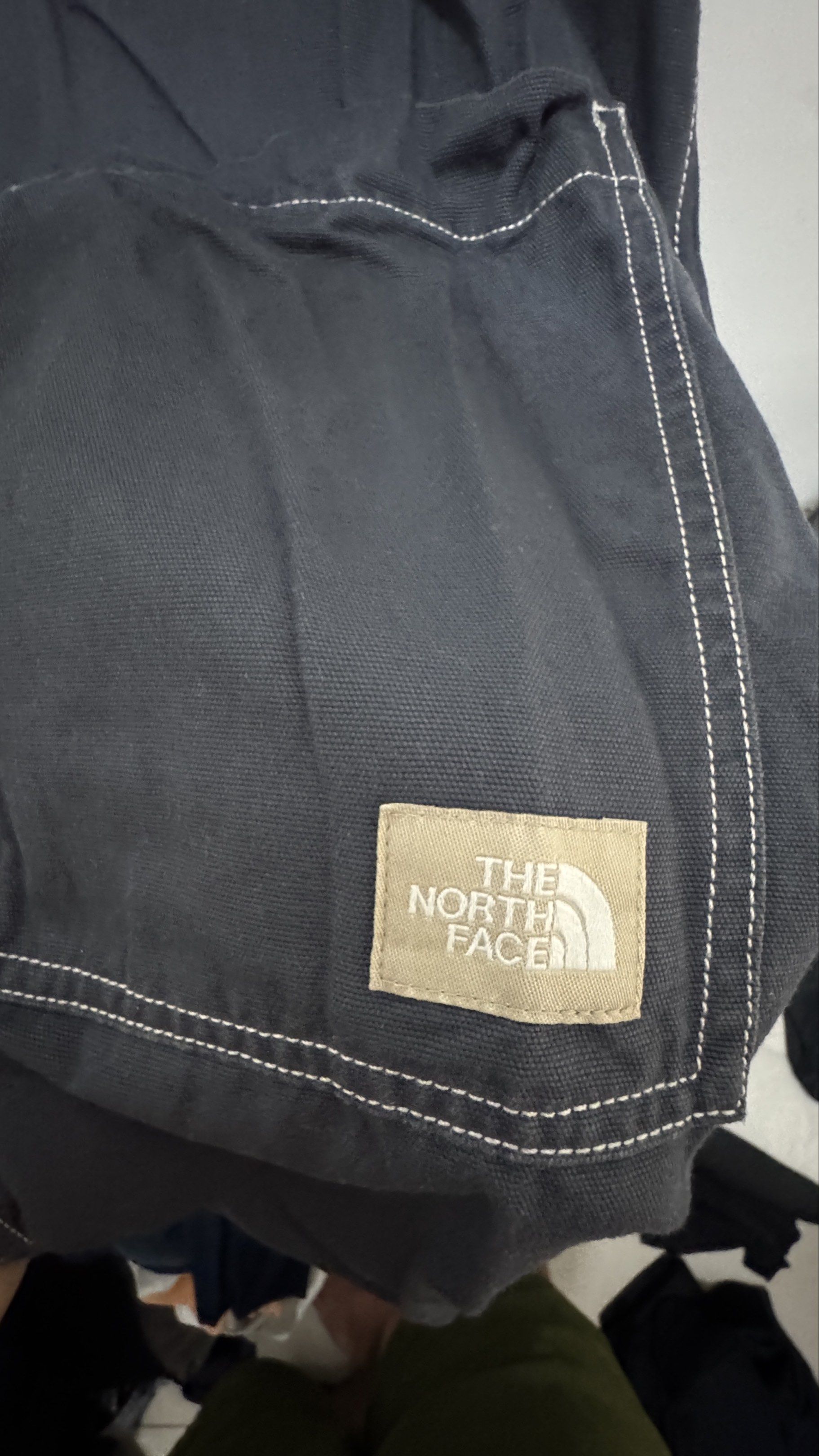 The North Face Jacket XL (Category: Coats, Jackets and Outerwear) located in Manila. Submitted by offthehype (Listing ID 1420428734, Image 2). Description: - The North Face jacket - Color: Dark Grey - Size: XL/105 - Button-up front - Two front pockets - White stitching details - Elastic cuffs - The North Face logo (front and back) - Thick denim like fabric Price is negotiable Good for overshirt or layering.