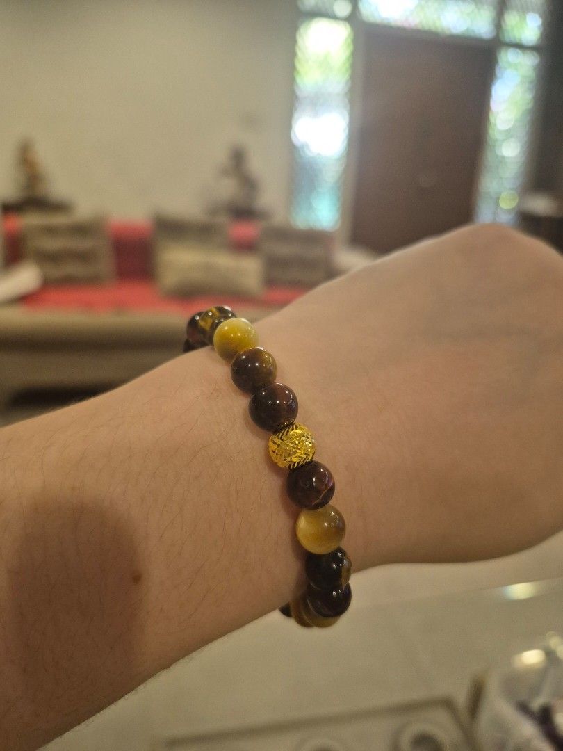 Tiger Eye Bead Bracelet with Gold Accent (Category: Bracelets) located in Pasay City. Submitted by ms0718 (Listing ID 1420374728, Image 1). Description: - Tiger eye beads in brown and yellow - Gold-colored accent bead - Stretch bracelet design - Elastic band - Polished finish - Suitable for various wrist sizes.