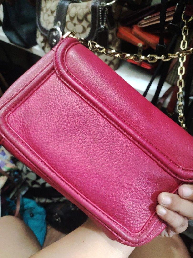 Tory Burch Pink Chain Bag (Category: Luxury Bags & Wallets) located in Zamboanga. Submitted by Clairey03 (Listing ID 1420446736, Image 3). Description: - Pink Tory Burch handbag - Gold chain strap - Gold logo detail - Flap closure - Minor marks on front - Interior condition unknown bawal sa maselan.
