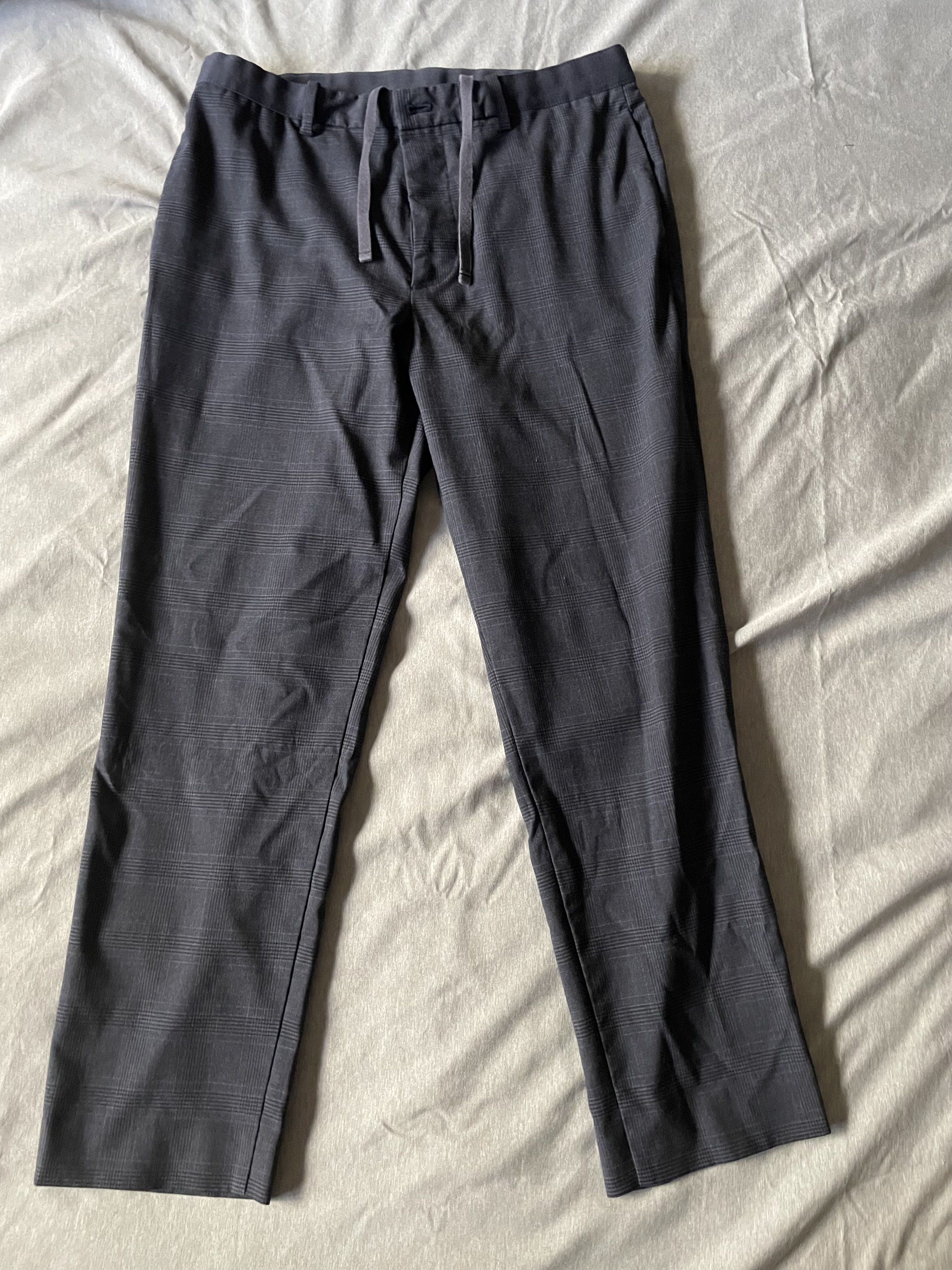 Uniqlo Men's Drawstring Pants (Category: Trousers) located in Manila. Submitted by lrj_stuff (Listing ID 1420358120, Image 2). Description: - Uniqlo Plaid Pants - Size: M (Waist 74-84cm) - Features: Drawstring waist, button closure - Material: Polyester, rayon, nylon, spandex blend.