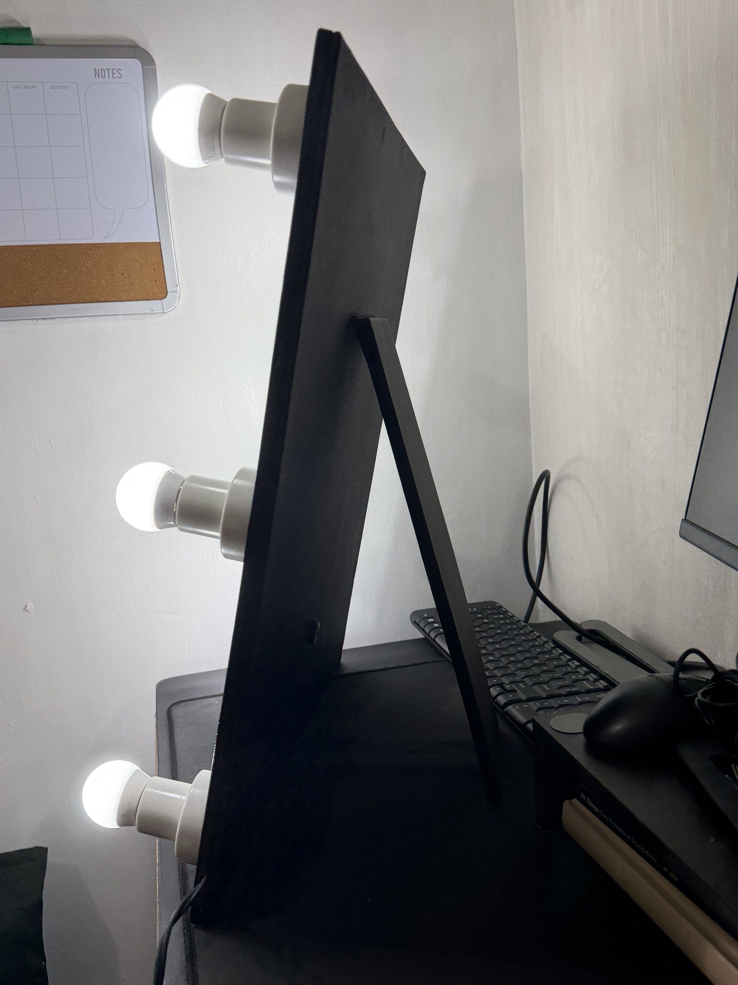 Vanity Mirror with Lights (Category: Mirrors) located in Makati City. Submitted by brijette_ (Listing ID 1420372037, Image 3). Description: - Vanity mirror with built-in lights - Black frame - Stand for desk - Includes power cord - Comes with a black carrying bag.