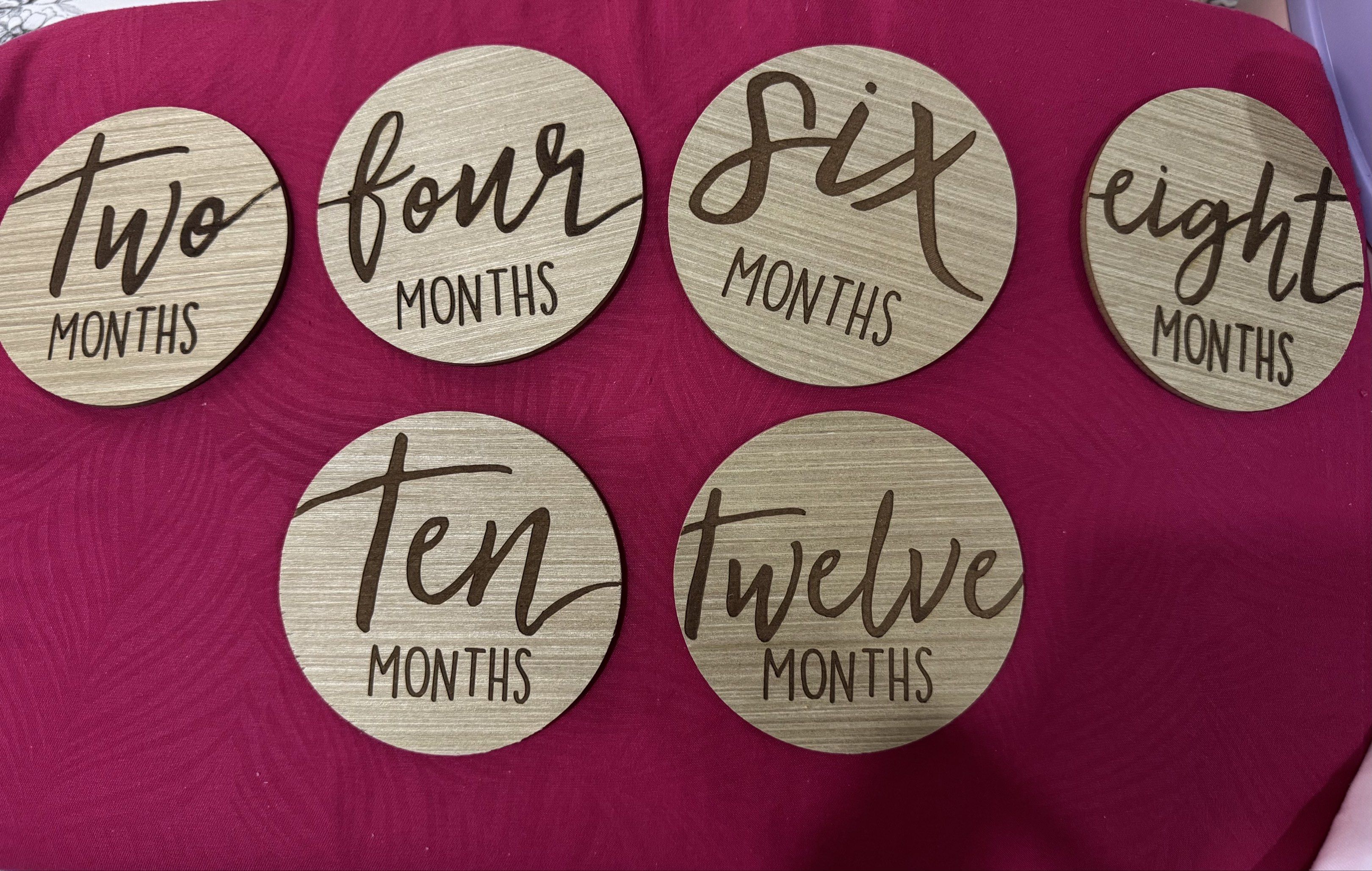 Wooden Baby Milestone Discs (Category: Other Kids Furniture) located in Cainta. Submitted by fifffiiii (Listing ID 1420368036, Image 2). Description: - Set of wooden milestone discs for baby photos. - Includes discs for: 1 to 12 months. - Each disc is round with engraved text. - Great for capturing baby's monthly milestones. - Perfect for photos!.