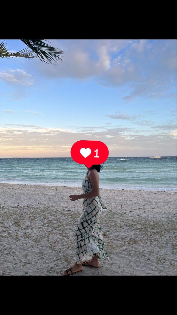 Zara Insp Dress (Category: Dresses) located in Lucena. Submitted by helpmedeclutter07 (Listing ID 1420446131, Image 1). Description: - Green and white patterned maxi dress - Halter neckline - Flowy silhouette - Lightweight and comfortable - Ideal for warm weather - Versatile for beach days or casual outings - Slight flaw on the bottom part.