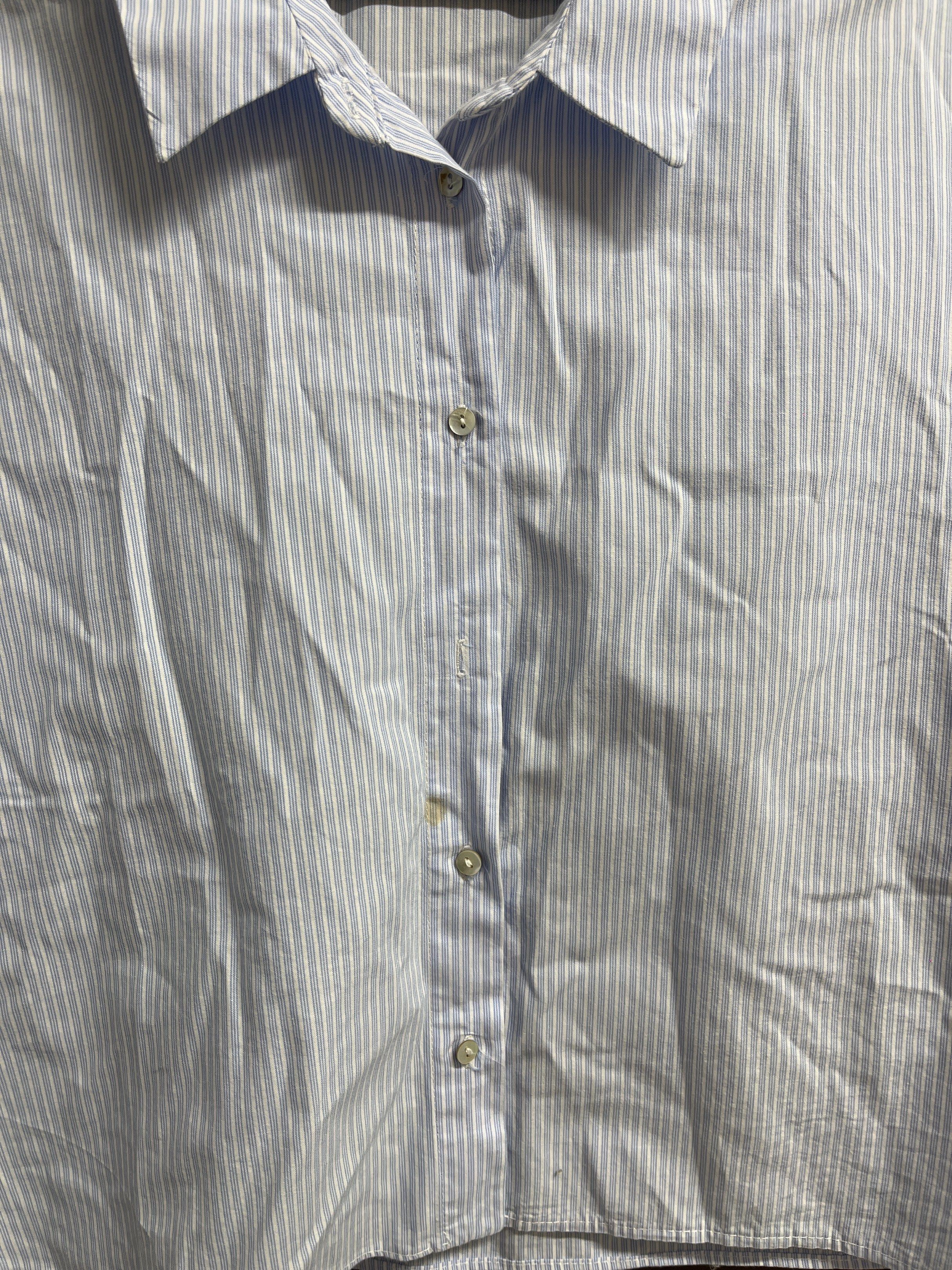 Zara TRF Striped Cropped Top (Category: Blouses) located in Muntinlupa City. Submitted by timttam (Listing ID 1420470611, Image 3). Description: - Zara TRF cropped top - Size: S - Features a light blue and white striped pattern - Collared neckline - Short sleeves - Button-down closure - Made in Morocco - missing one button.