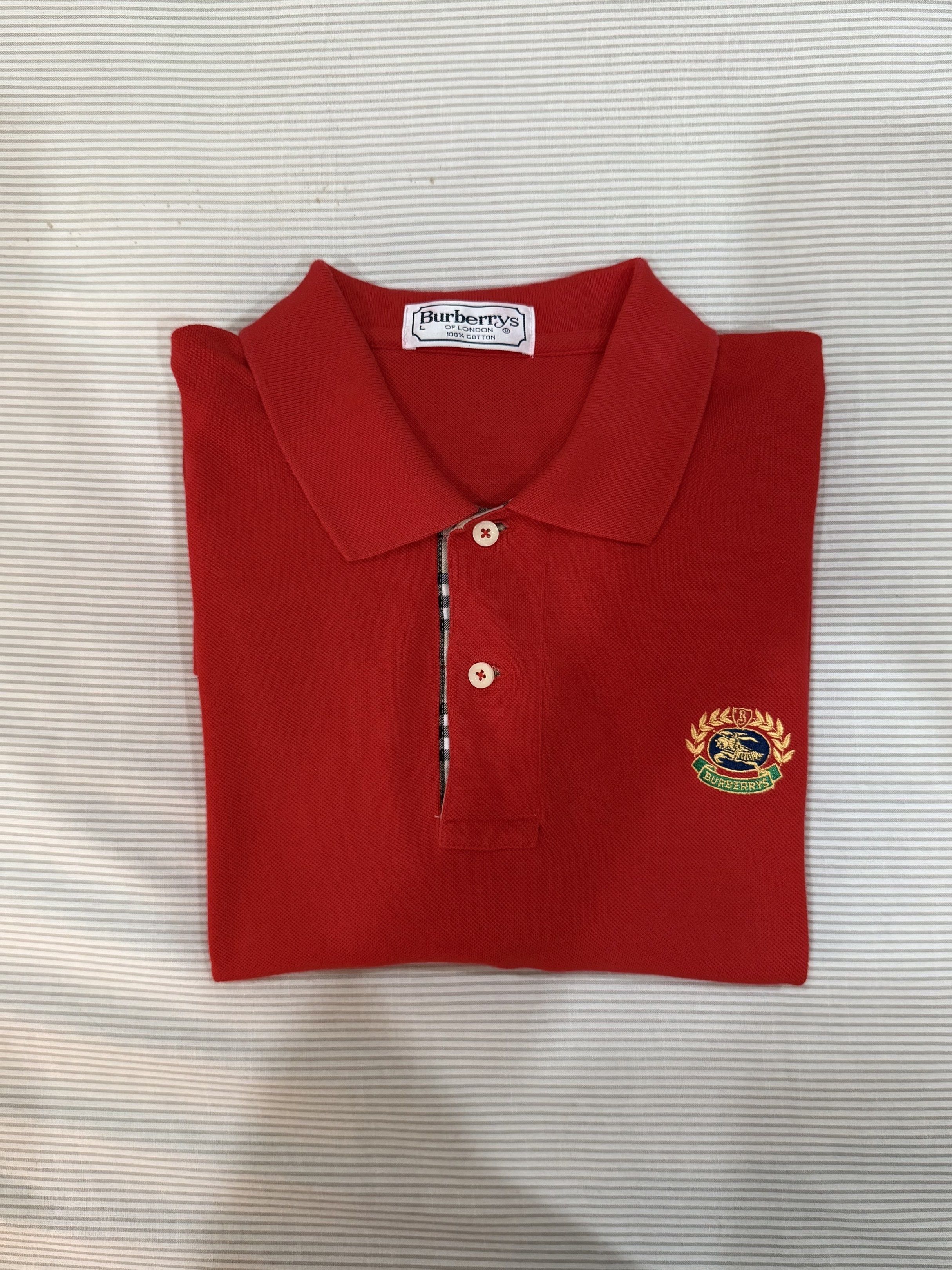 Burberrys Vintage Red Long sleeves Jacket (Category: Coats, Jackets and Outerwear) located in Quezon City. Submitted by nyc1900 (Listing ID 1420712681, Image 2). Description: Vintage Burberrys long-sleeved polo shirt. Never been used. Length: 30” Chest: 22” Shoulder: 20” Sleeve: 23” - Eye-catching red color - Size: L - Features iconic Burberry check detailing on collar and cuffs - A classic and stylish addition to any wardrobe NEGOTIABLE 🫡 DM fo