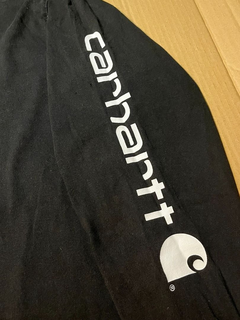 Carhartt TK0231-M Black Long sleeve (Category: Activewear) located in Batangas. Submitted by ukayro (Listing ID 1420708017, Image 2). Description: Carhartt TK0231-M BLK XL Loose Fit 27 W 32 L Issue: pinholes, bite-like on hem.