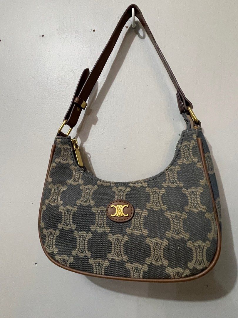 Celine Shoulder Bag (Category: Luxury Bags & Wallets) located in Lupao. Submitted by jennylynda42204 (Listing ID 1420716697, Image 2). Description: - Authentic Celine shoulder bag - Signature pattern design - Elegant curved shape - Brown leather strap and trim - Secure zipper closure - Subtle logo detail.