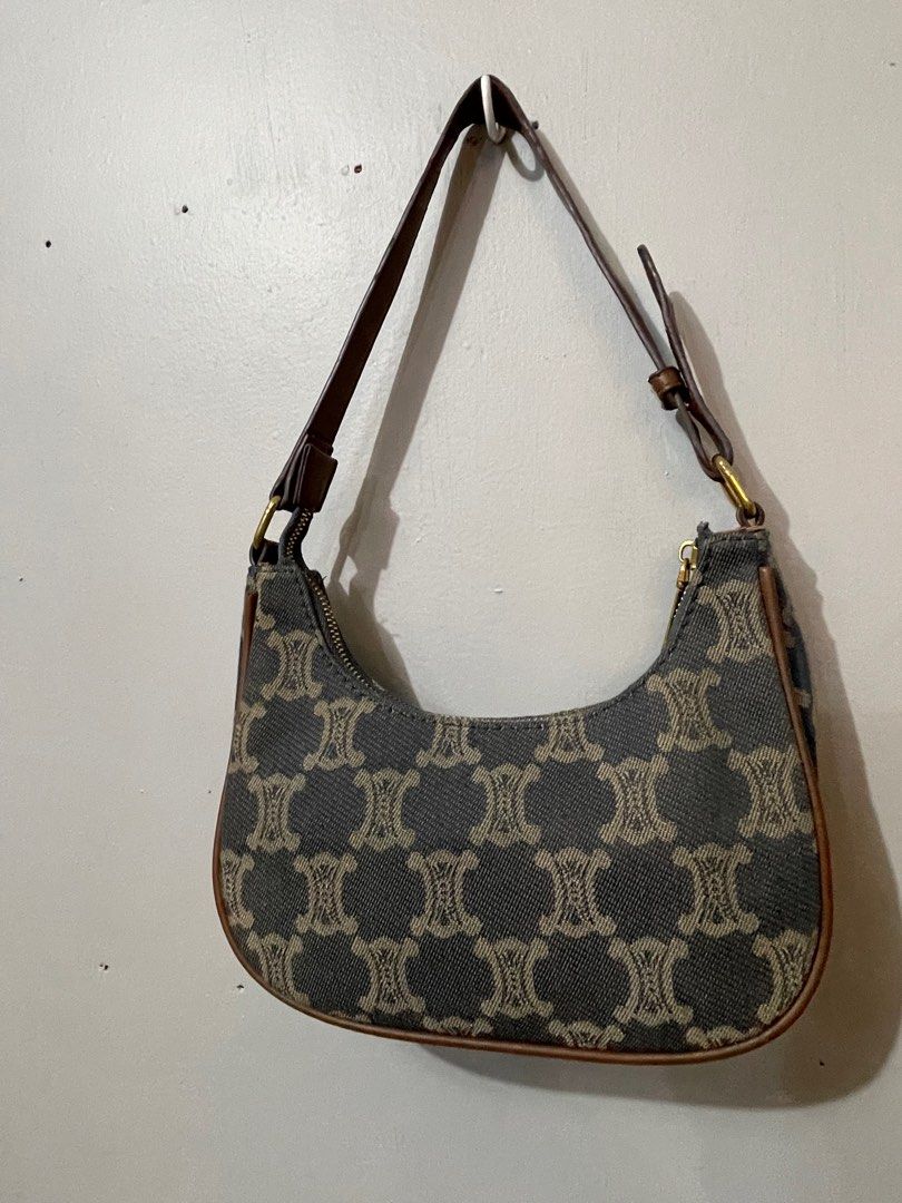 Celine Shoulder Bag (Category: Luxury Bags & Wallets) located in Lupao. Submitted by jennylynda42204 (Listing ID 1420716697, Image 3). Description: - Authentic Celine shoulder bag - Signature pattern design - Elegant curved shape - Brown leather strap and trim - Secure zipper closure - Subtle logo detail.