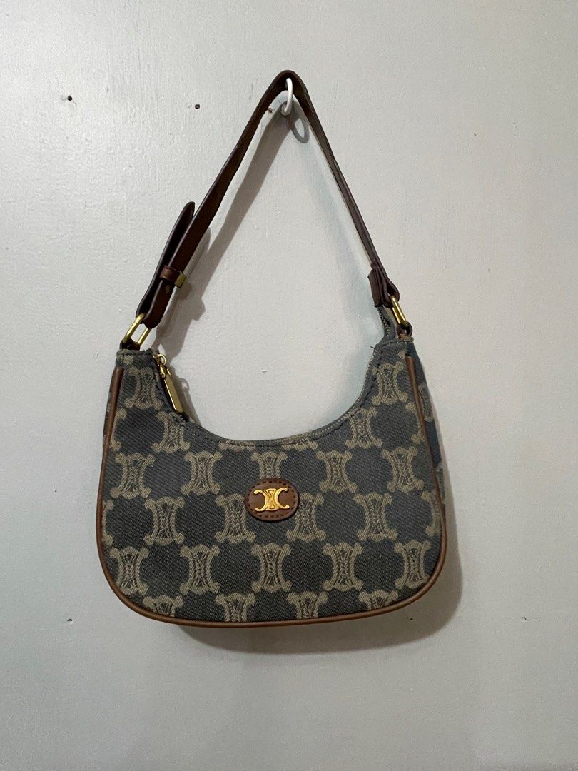 Celine Shoulder Bag (Category: Luxury Bags & Wallets) located in Lupao. Submitted by jennylynda42204 (Listing ID 1420716697, Image 1). Description: - Authentic Celine shoulder bag - Signature pattern design - Elegant curved shape - Brown leather strap and trim - Secure zipper closure - Subtle logo detail.