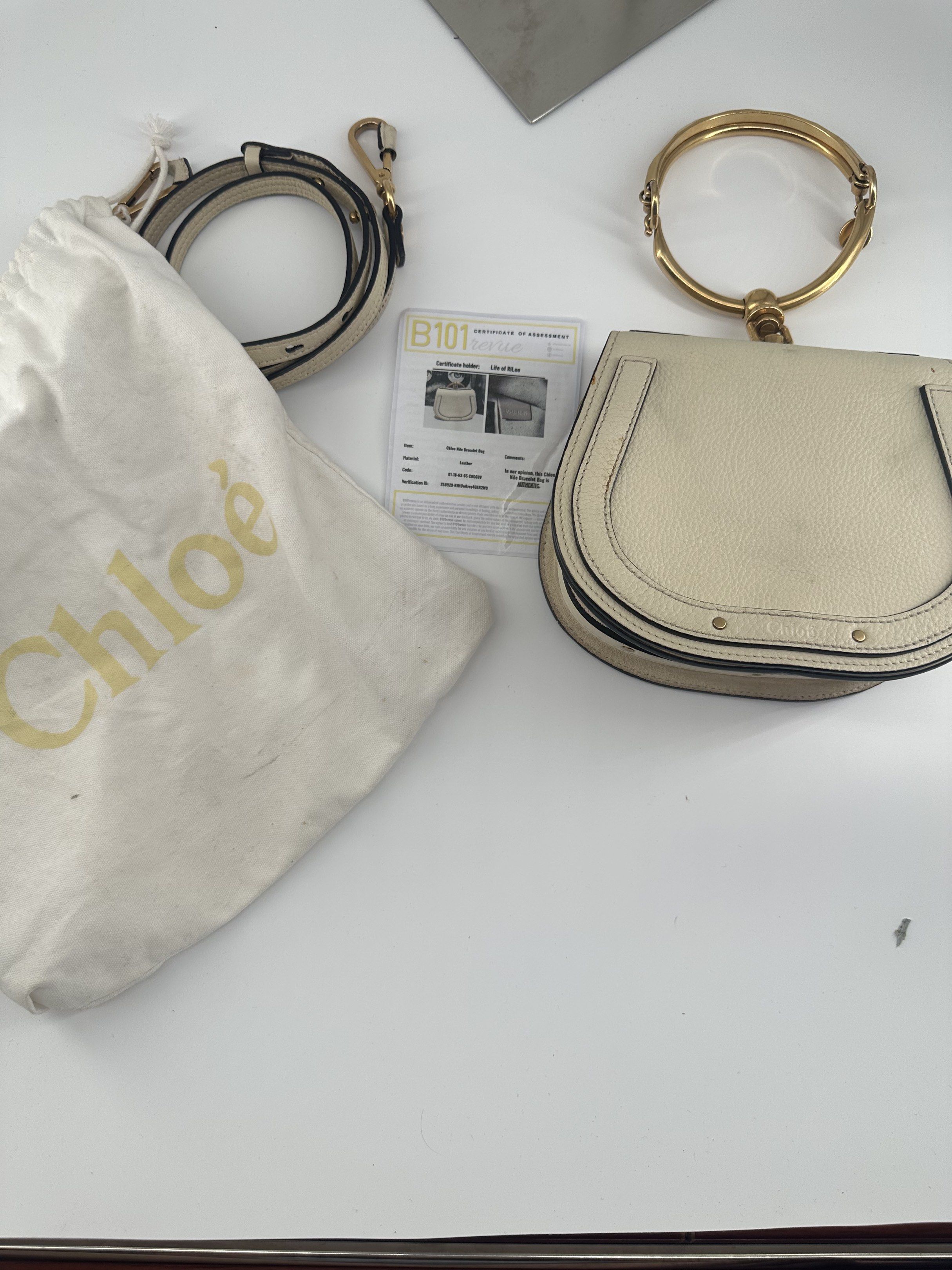 Chloe Nile Bracelet Bag (Category: Luxury Bags & Wallets) located in Manila. Submitted by allthingsilove65 (Listing ID 1420560737, Image 3). Description: - Authentic Chloe Nile Bracelet Bag - Cream color - Gold-tone bracelet handle - Detachable shoulder strap - Includes dust bag and authenticity card - Stylish and iconic design -with Authenticity card.