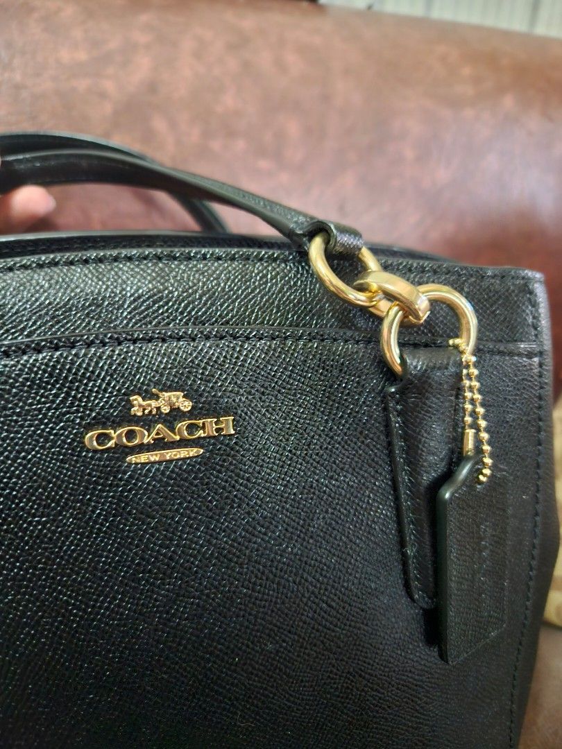 Coach Minetta - Black Satchel (Category: Luxury Bags & Wallets) located in Angono. Submitted by julee031224 (Listing ID 1420589360, Image 3). Description: - Authentic Coach satchel handbag - Gold-tone hardware - Detachable shoulder strap - Interior zippered pocket - Top handle - Coach logo on front - Made of leather - Comes with hangtag.
