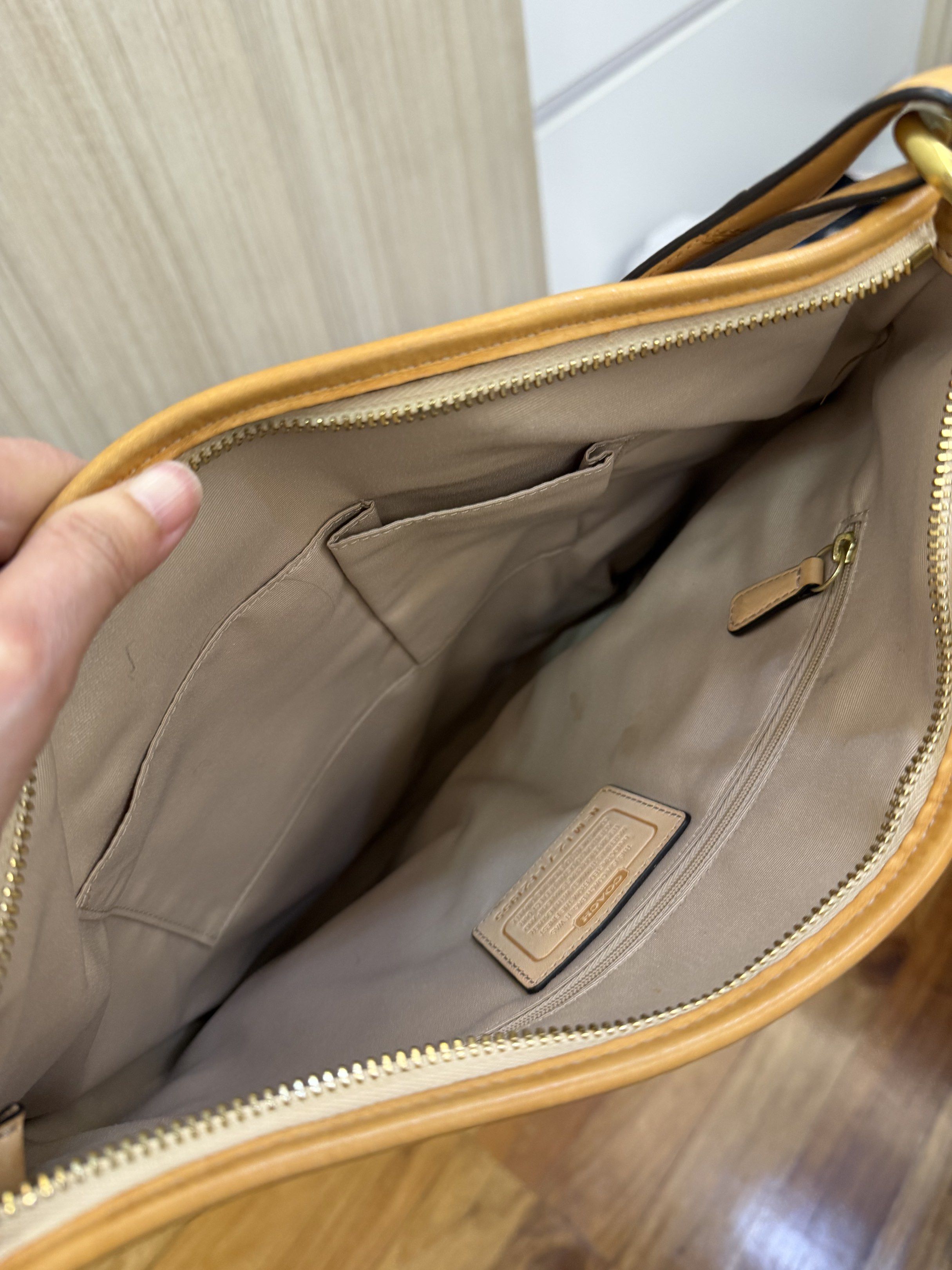 Coach Peyton Tattersall Plaid Shoulder Bag (Category: Luxury Bags & Wallets) located in Manila. Submitted by mts7890 (Listing ID 1420594141, Image 3). Description: - Coach shoulder bag - Plaid pattern - Tan leather strap and trim - Beige lining with multiple pockets - Gold-toned hardware - Zipper closure - Includes Coach hangtag.