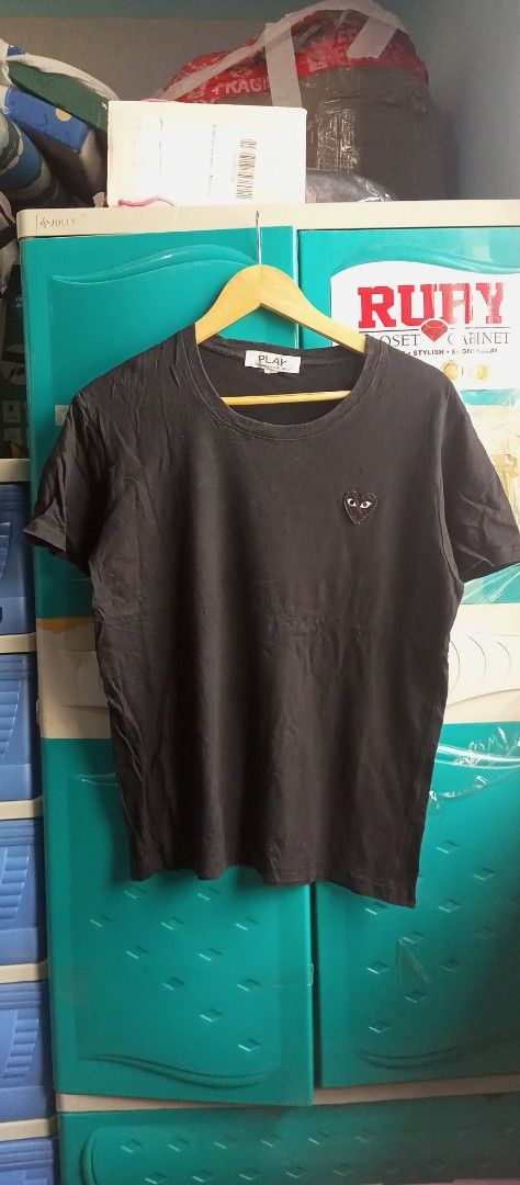 Comme des Garcons Play Black T-shirt (Category: Shirts) located in Calamba. Submitted by ironjayy050812 (Listing ID 1420606416, Image 1). Description: excellent condition issue 1 pinhole unnoticable nasa pic dimes 19-25 - Black Comme des Garcons Play T-shirt - Features the iconic heart logo - Crew neck and short sleeves - Brand tag visible.