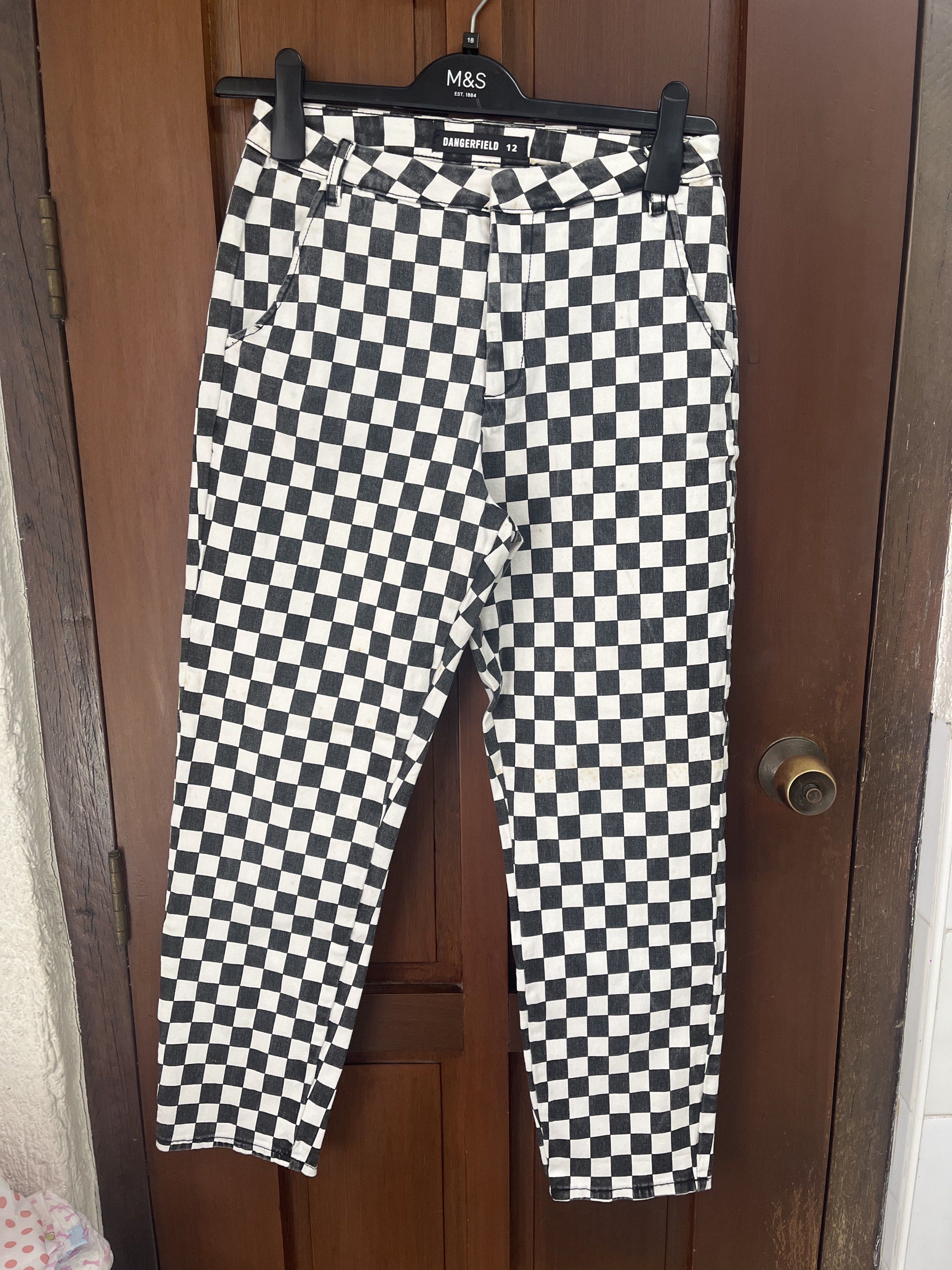 Dangerfield Checkered Pants (Category: Other Bottoms) located in Muntinlupa City. Submitted by timttam (Listing ID 1420600447, Image 1). Description: - Dangerfield checkered pants - Size 12 - Black and white checkered pattern - Classic five-pocket design - Straight leg cut - Durable fabric - Perfect for everyday wear.