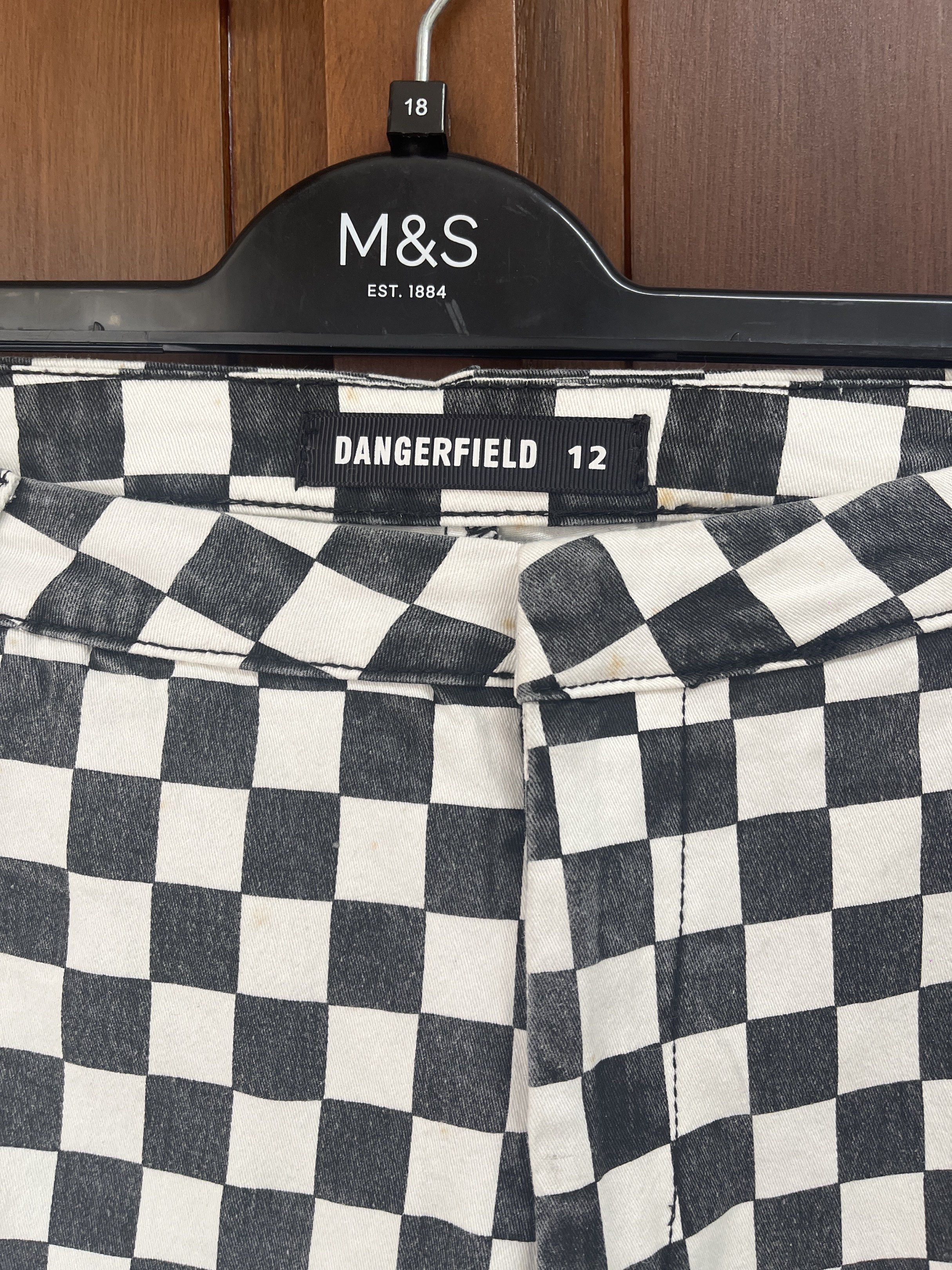 Dangerfield Checkered Pants (Category: Other Bottoms) located in Muntinlupa City. Submitted by timttam (Listing ID 1420600447, Image 2). Description: - Dangerfield checkered pants - Size 12 - Black and white checkered pattern - Classic five-pocket design - Straight leg cut - Durable fabric - Perfect for everyday wear.