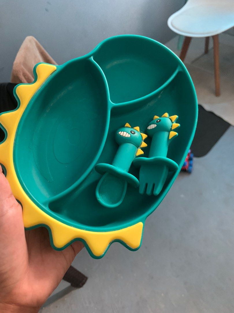 Dinosaur-Themed Baby Feeding Plate Set (Category: Weaning & Toddler Feeding) located in Cavite. Submitted by calmxxx22 (Listing ID 1420627600, Image 2). Description: - Adorable dinosaur-themed feeding set. - Includes a divided plate, spoon, and fork. - Divided plate with three compartments. - Made of soft, flexible material. - Easy to clean. - Perfect for making mealtime enjoyable for your baby!.