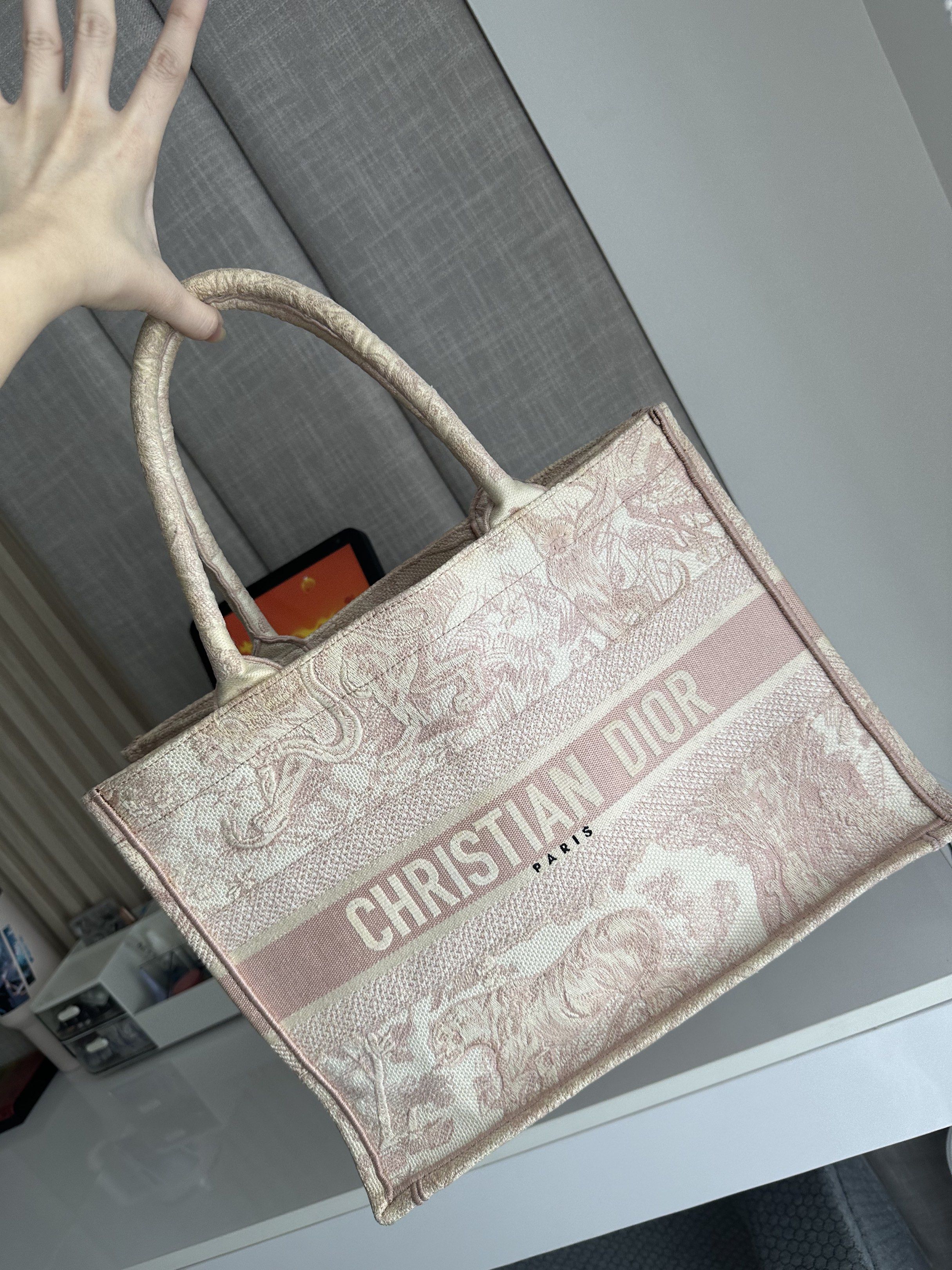 Dior Book Tote (Category: Luxury Bags & Wallets) located in Manila. Submitted by kaths208 (Listing ID 1389082243, Image 2). Description: Super sayang hindi na gagamit coz I owned two book tote, got it from cjvluxe. Condition: Well used Market Price: ₱90k and above for preloved Needs cleaning! Declutterring my bags!!!!.