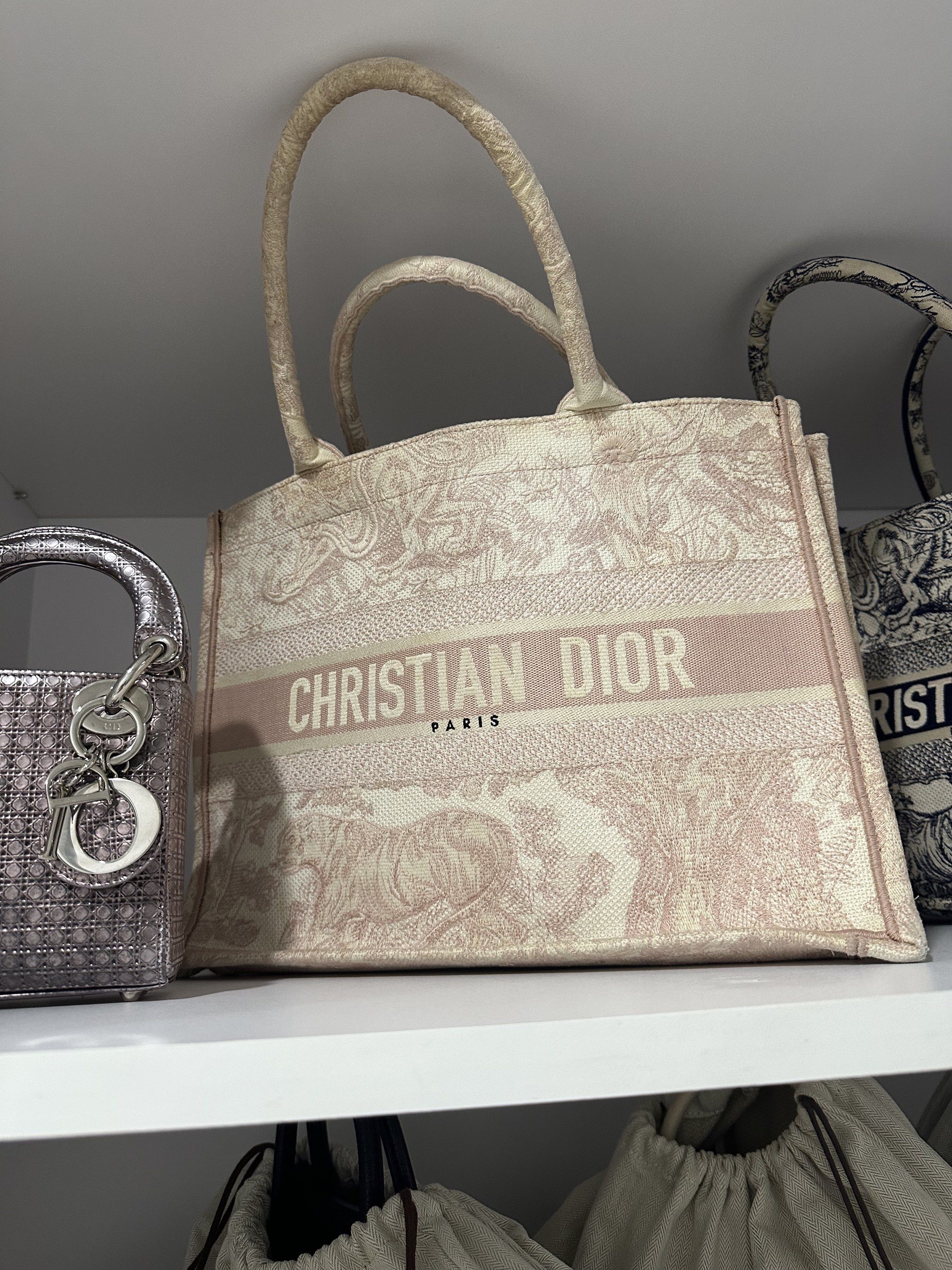 Dior Book Tote (Category: Luxury Bags & Wallets) located in Manila. Submitted by kaths208 (Listing ID 1389082243, Image 1). Description: Super sayang hindi na gagamit coz I owned two book tote, got it from cjvluxe. Condition: Well used Market Price: ₱90k and above for preloved Needs cleaning! Declutterring my bags!!!!.