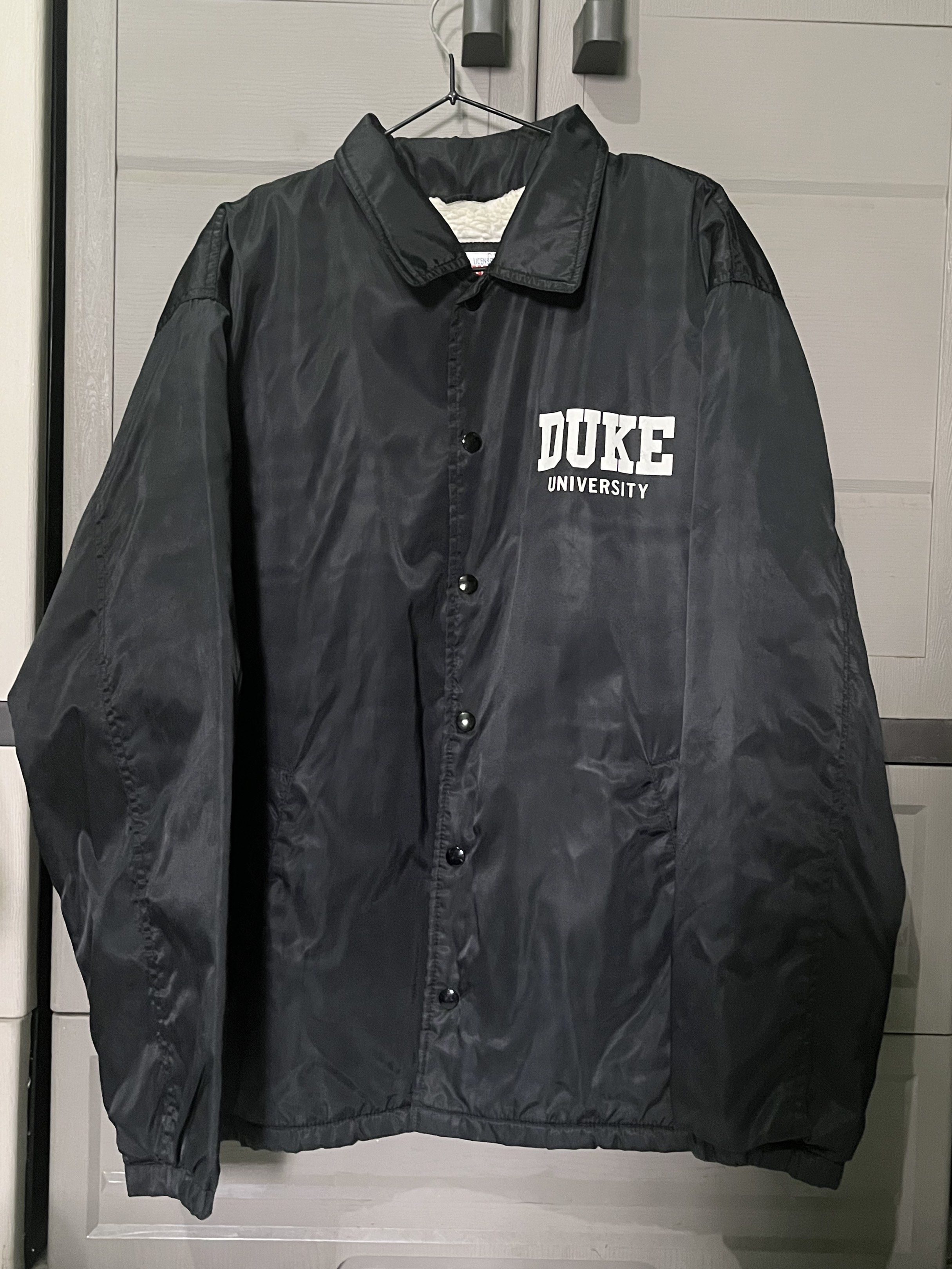 Duke University Warm Coach Jacket (Black) (Category: Coats, Jackets and Outerwear) located in Paranaque City. Submitted by BeyondRepair (Listing ID 1420608108, Image 1). Description: Duke University coach jacket. Size L. Button-up closure, collared neckline. Perfect pang rides and pang baguio or tagaytay. Color rate: 9/10 Plus shipping fee. Dimes: W 25 x L 29.