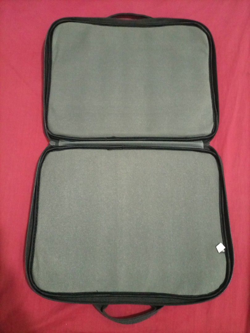 Elecom Laptop Bag (Category: Laptop Bags & Sleeves) located in Bacoor. Submitted by imshining_23 (Listing ID 1420667834, Image 3). Description: - Black Elecom laptop bag - With a convenient handle - Secure zippered closure - Includes a front pocket - Padded interior for laptop protection - Simple and functional design Size: 14.4" x 11" Great for 11.6 inches of wide, 12.1 inches of wide, 13.3 inches of wide, 14.1 inches of wide, 12.1 inches, 14.1 