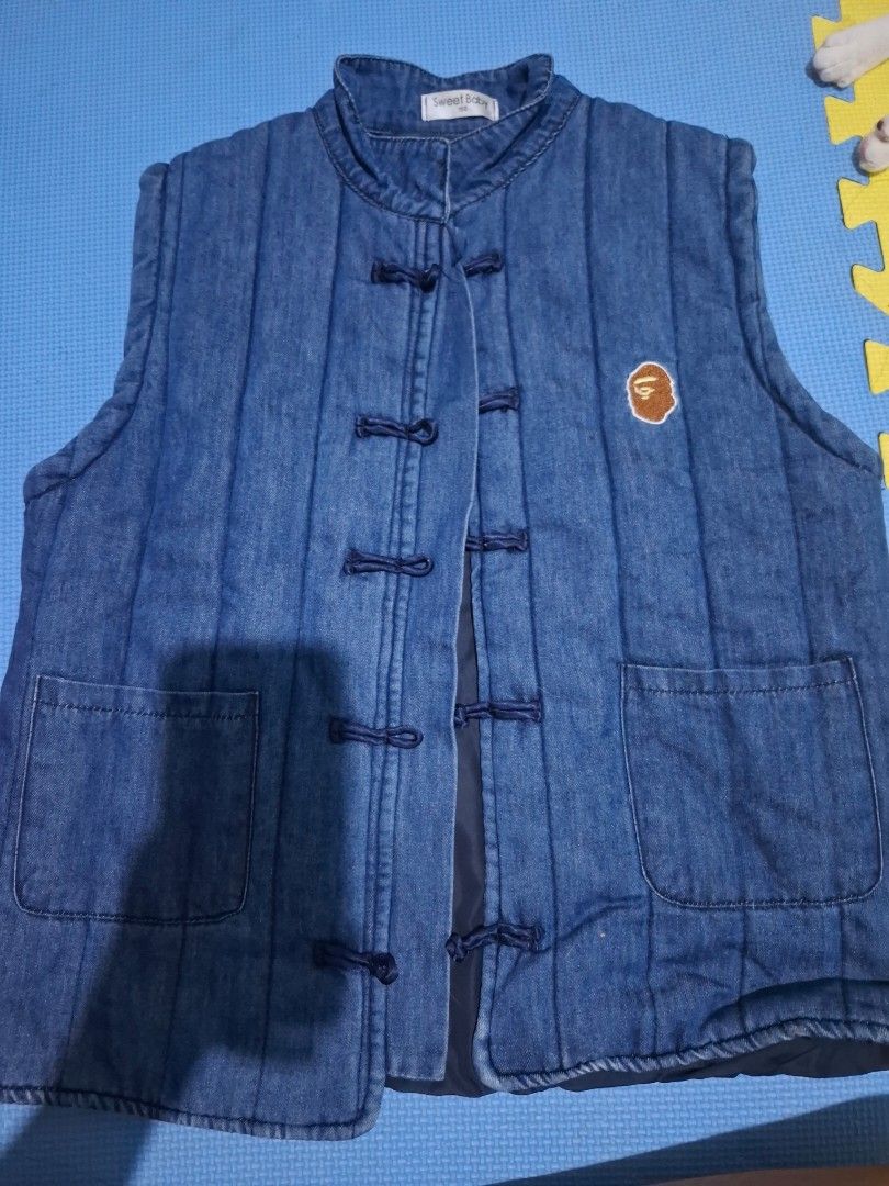 Evisu Denim Vest (Category: Vests) located in Manila. Submitted by wildcat-9fb3 (Listing ID 1420644132, Image 1). Description: - Denim vest - Mandarin collar - Toggle closures - Two front pockets - Small logo - Embroidered "MOVE LIKE EVISU" on the back (red and white) - Quilted - Denim material Never used. Send chat for more pictures. buyer will shoulder the delivery fee :).