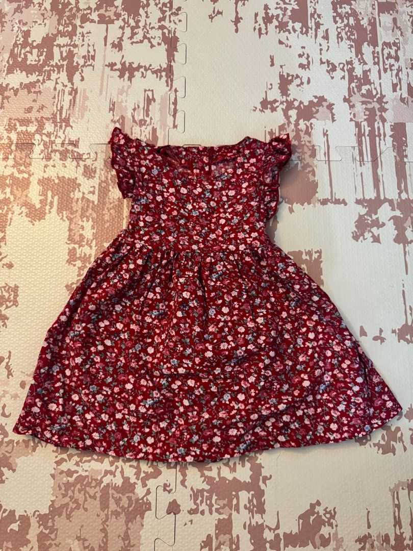 Floral Dress with Flutter Sleeves (Category: Dresses) located in Calamba. Submitted by xhrnn (Listing ID 1420650778, Image 1). Description: Dress features a vibrant floral pattern in shades of red, pink, and blue. It has flutter sleeves and a fitted bodice that flows into a flared skirt. The dress includes a matching tie-waist for a customizable fit. Perfect for casual outings or special occasions..