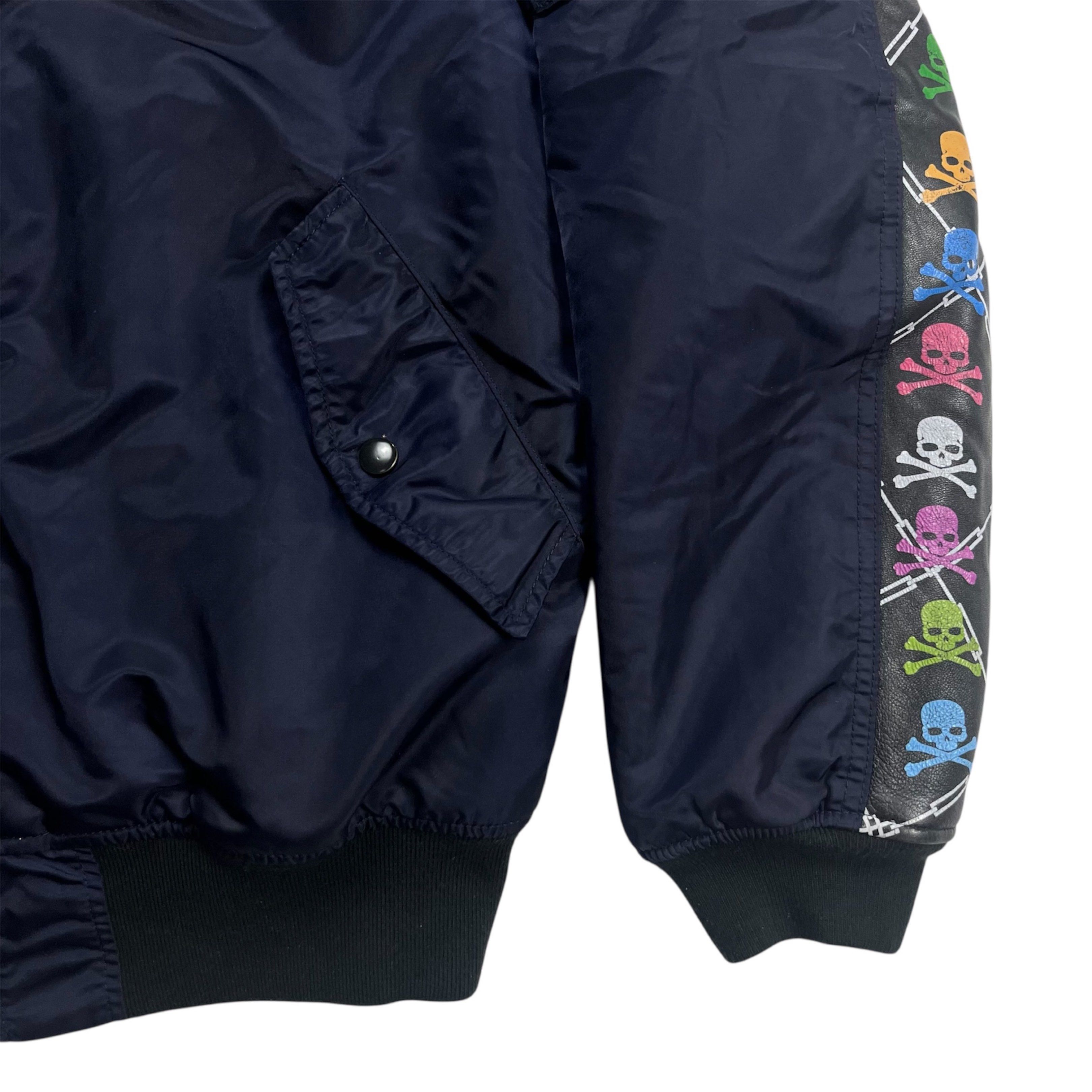 FW 2013 Mastermind x Uniform Experiment ‘Skull and Bones’ Bomber Jacket (Category: Coats, Jackets and Outerwear) located in Quezon City. Submitted by jusjawnz (Listing ID 1420575795, Image 2). Description: From FW 2013, this Mastermind x Uniform Experiment “Skull and Bones” bomber jacket is cut in a traditional bomber silhouette and features embroidered Mastermind skulls running down the right sleeve, contrasted by leather trim adorned with skull