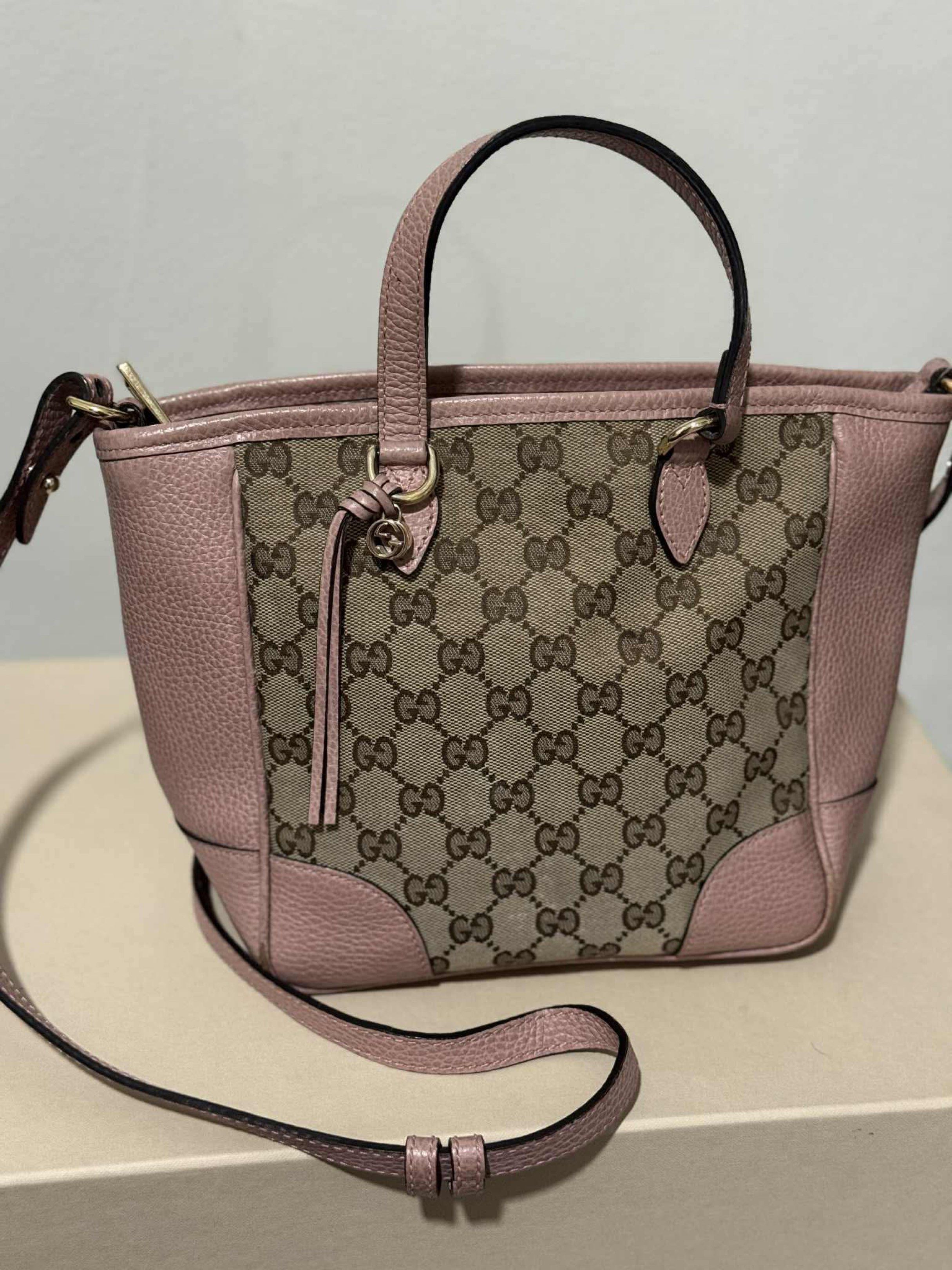 Gucci GG Canvas Pink Handbag (Category: Luxury Bags & Wallets) located in Batangas. Submitted by mjdel (Listing ID 1420742050, Image 1). Description: - Authentic Gucci handbag - Iconic GG canvas design - Pink leather accents - Top handle and detachable shoulder strap - Multiple interior compartments - Includes Gucci charm - Gold-toned hardware.
