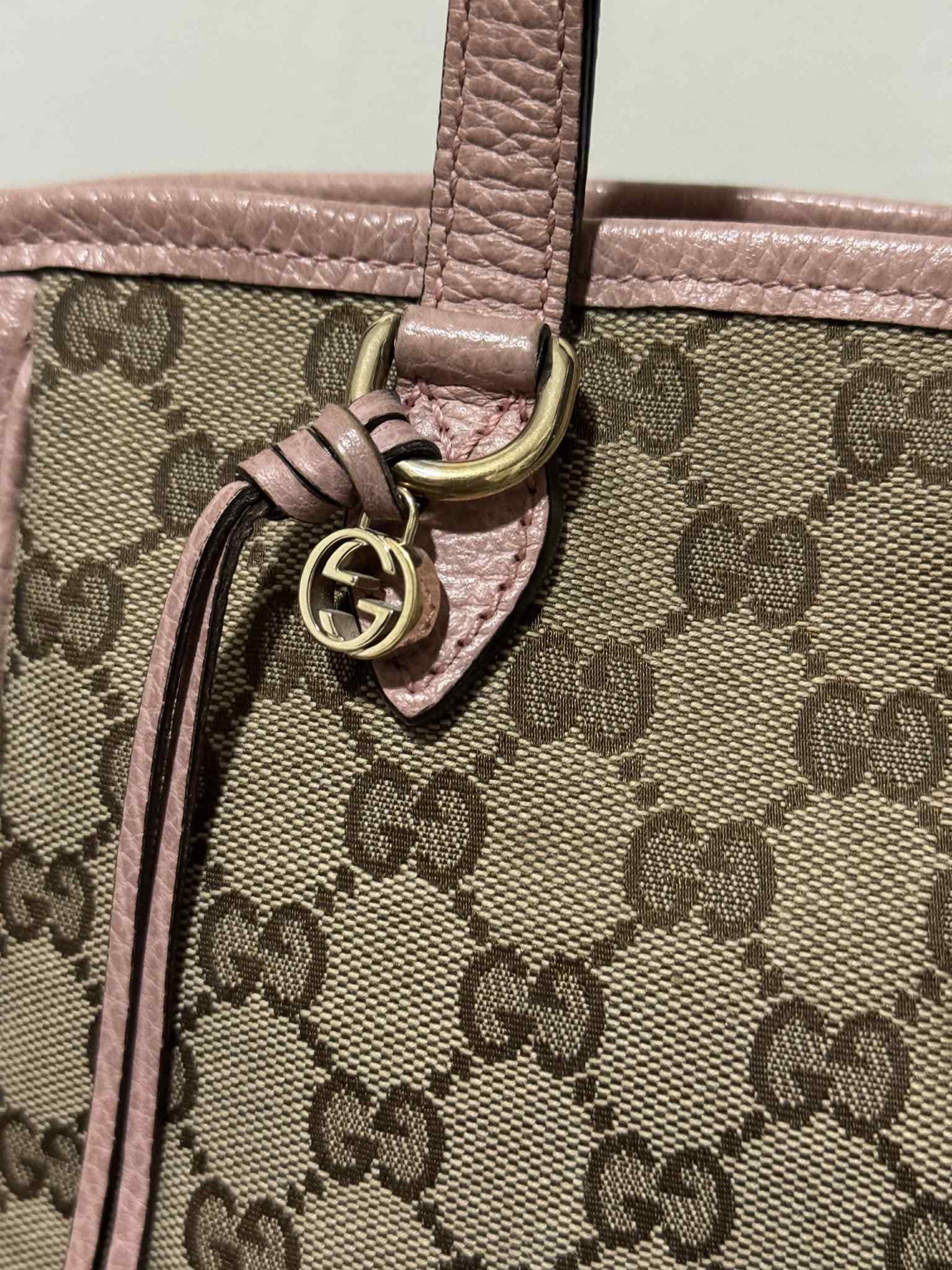Gucci GG Canvas Pink Handbag (Category: Luxury Bags & Wallets) located in Batangas. Submitted by mjdel (Listing ID 1420742050, Image 3). Description: - Authentic Gucci handbag - Iconic GG canvas design - Pink leather accents - Top handle and detachable shoulder strap - Multiple interior compartments - Includes Gucci charm - Gold-toned hardware.