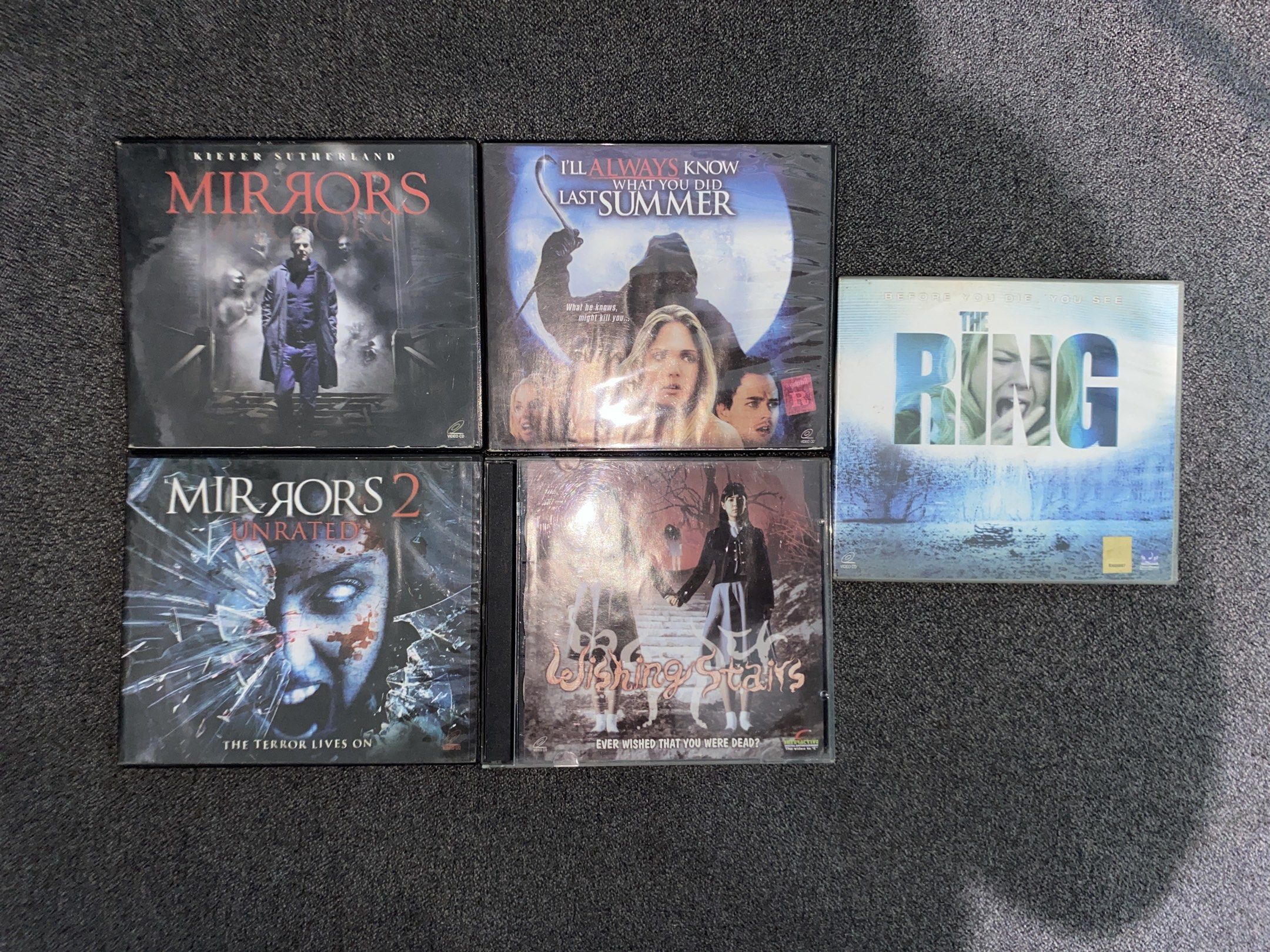 Horror Movie DVD Collection (Category: CDs & DVDs) located in Valenzuela. Submitted by lilychouchousether (Listing ID 1420666602, Image 1). Description: - Horror movie DVD collection. - Includes: "Mirrors", "Mirrors 2", "I'll Always Know What You Did Last Summer", "Wishing Stairs", and "The Ring". - All DVDs in original packaging. - Ideal for horror movie enthusiasts. PM FOR INQUIRY AND MORE PICTURES (BUY SHOULDERS SHIPPING FEE)‼️ SELLING STUFF F
