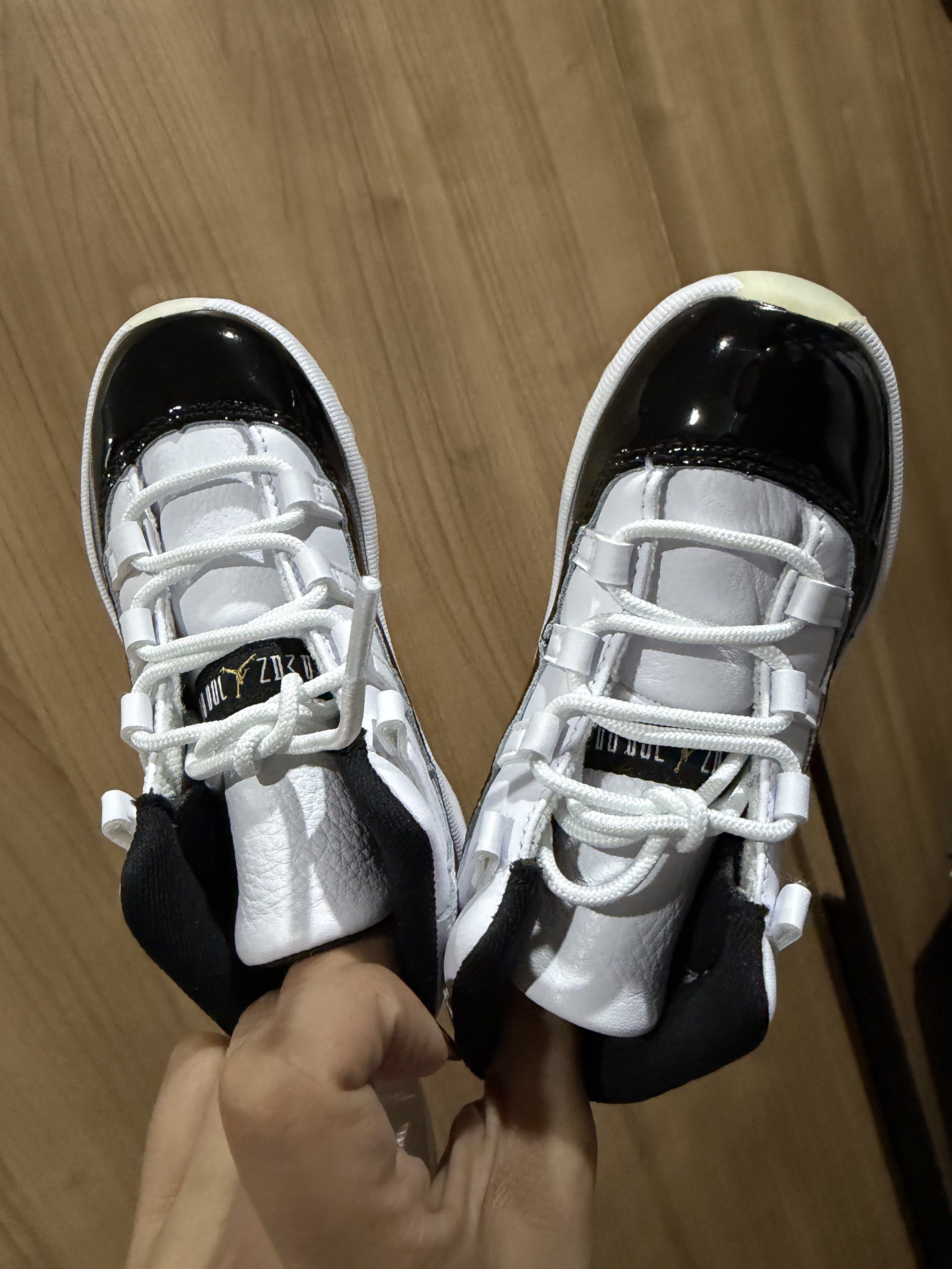 Jordan 11 Retro (TD) Black/White (Category: Babies & Kids Fashion) located in Quezon City. Submitted by cluttergoods (Listing ID 1420731427, Image 2). Description: Infant Jordan 11 Retro sneakers in black and white. Features a patent leather toe, white laces, and a black collar. The soles are translucent. Comes with the original box. Size is 9C..