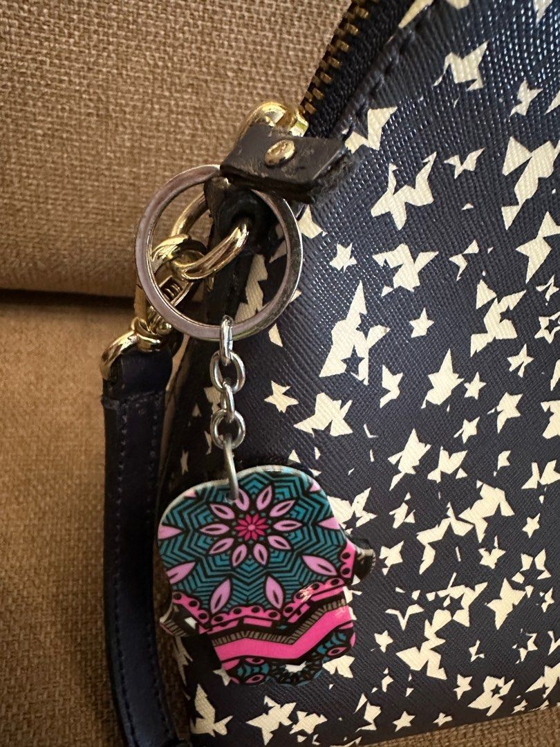 Kate Spade Star Print Satchel (Category: Luxury Bags & Wallets) located in Quezon City. Submitted by sofieegee (Listing ID 1420651482, Image 3). Description: - Kate Spade satchel - Navy and white star print - Includes Kate Spade logo charm - Interior: zip pocket - Lined with navy fabric with Kate Spade New York logo - Zip closure - has flaws see photos.