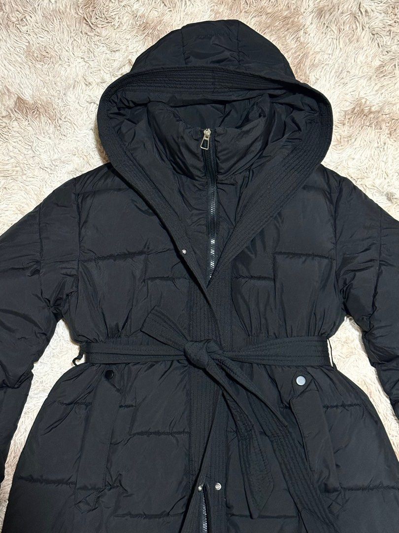 Long Black Puffer Coat (bought in Korea) (Category: Coats, Jackets and Outerwear) located in Paranaque City. Submitted by apcastillo (Listing ID 1420643509, Image 2). Description: Long Black Puffer Coat Personally bought this in Korea No flaws, in perfect condition Used once only Free size but fits S-L (it has zipper, buttons and a wrap around belt for snug fit) Measurements: - Arms length: 64cm - Arms width: 20cm - Coat Length: 97cm - Width: 57c