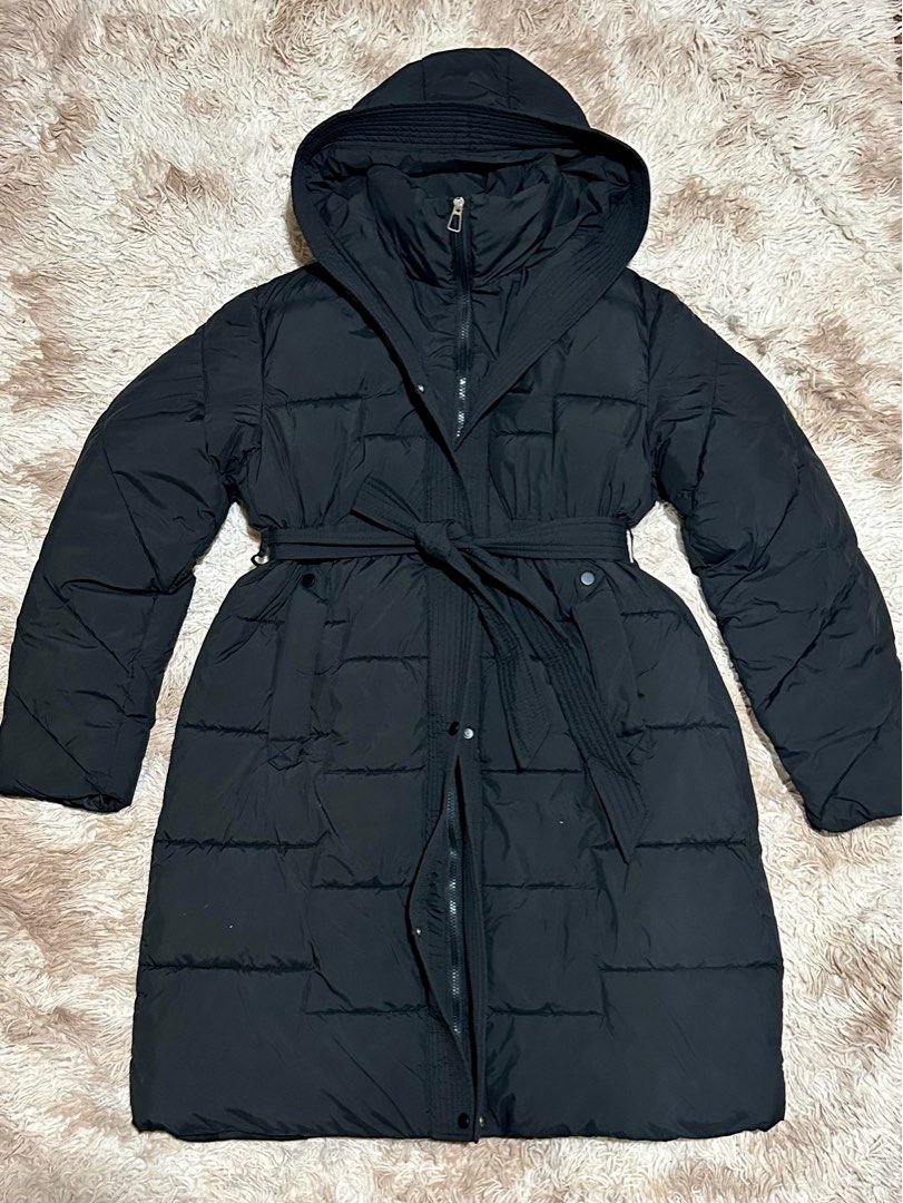 Long Black Puffer Coat (bought in Korea) (Category: Coats, Jackets and Outerwear) located in Paranaque City. Submitted by apcastillo (Listing ID 1420643509, Image 1). Description: Long Black Puffer Coat Personally bought this in Korea No flaws, in perfect condition Used once only Free size but fits S-L (it has zipper, buttons and a wrap around belt for snug fit) Measurements: - Arms length: 64cm - Arms width: 20cm - Coat Length: 97cm - Width: 57c