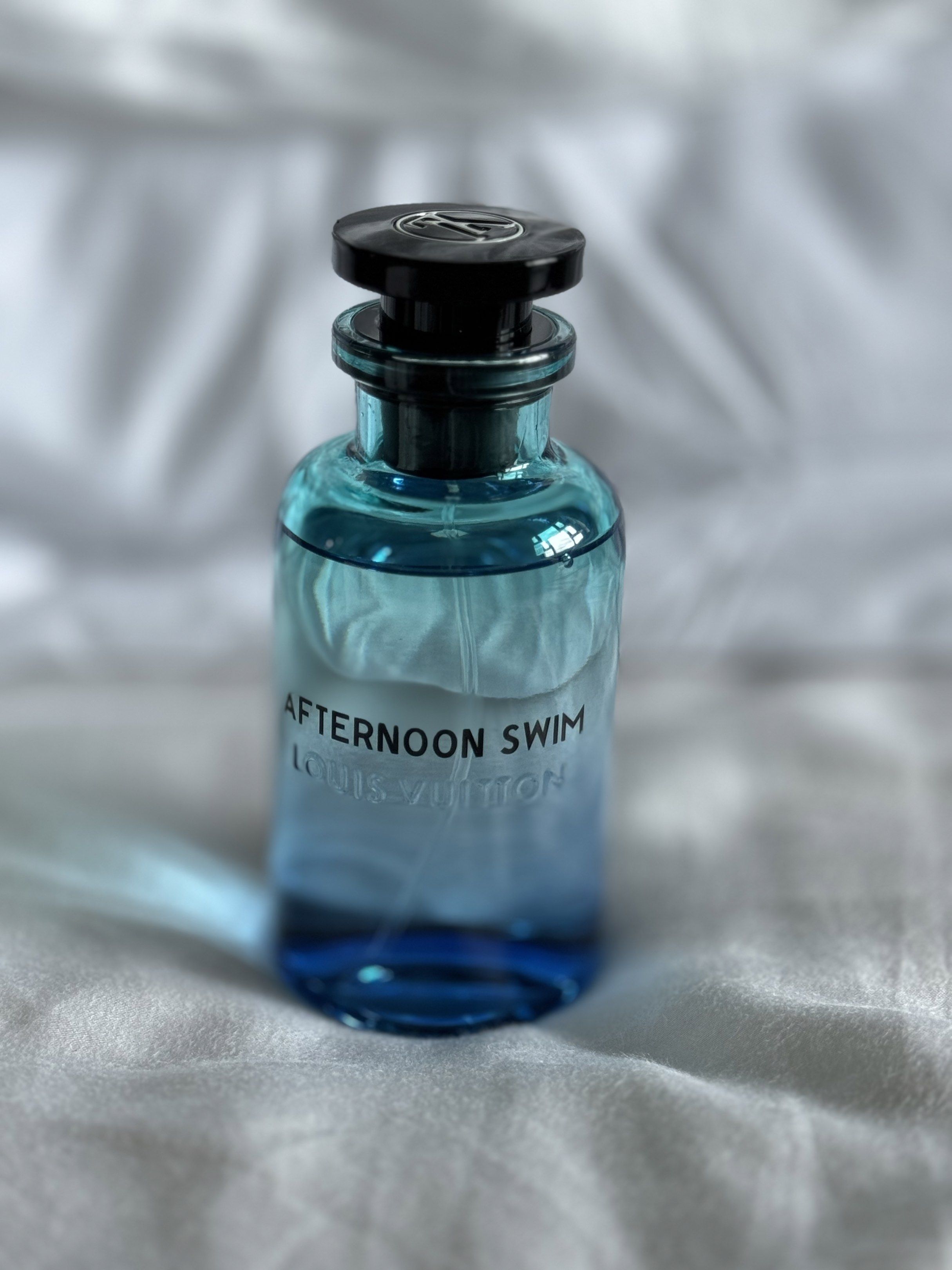 Louis Vuitton Afternoon Swim Perfume (Category: Fragrance & Deodorants) located in Cavite. Submitted by shopmostloved (Listing ID 1420580122, Image 3). Description: - Authentic Louis Vuitton Afternoon Swim perfume - Gradient blue bottle - Black cap with Louis Vuitton logo - Comes with original box and packaging - White box with perfume name printed on it - Cylindrical blue box - Bought this from LV Greenbelt on 02/04/2026 -Used 2x - Comes with th