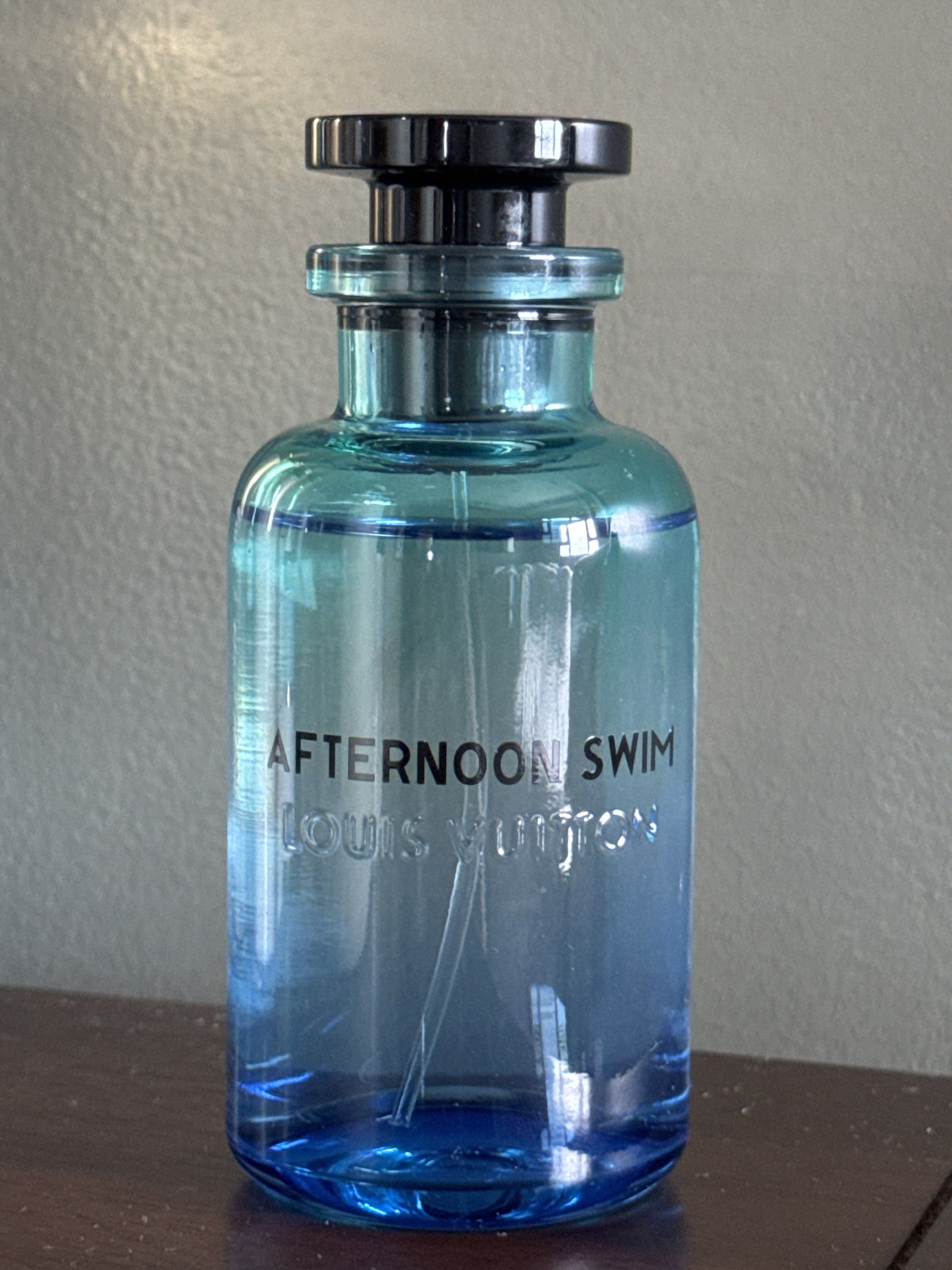 Louis Vuitton Afternoon Swim Perfume (Category: Fragrance & Deodorants) located in Cavite. Submitted by shopmostloved (Listing ID 1420580122, Image 2). Description: - Authentic Louis Vuitton Afternoon Swim perfume - Gradient blue bottle - Black cap with Louis Vuitton logo - Comes with original box and packaging - White box with perfume name printed on it - Cylindrical blue box - Bought this from LV Greenbelt on 02/04/2026 -Used 2x - Comes with th
