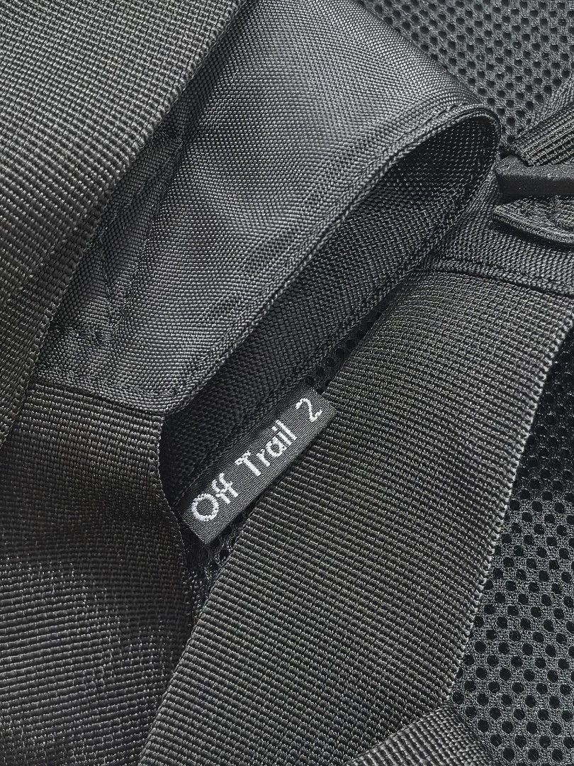 Lowepro Off Trail 2 Camera Bag (Category: Camera Bags & Carriers) located in Quezon City. Submitted by studiojpeg (Listing ID 1420619077, Image 3). Description: Lowepro Off Trail 2 camera bag is designed for outdoor photography. It features multiple compartments, including side pockets and a main compartment with a mesh lining. The bag has a black exterior and a sturdy strap for carrying. The Lowepro logo is visible on the front..