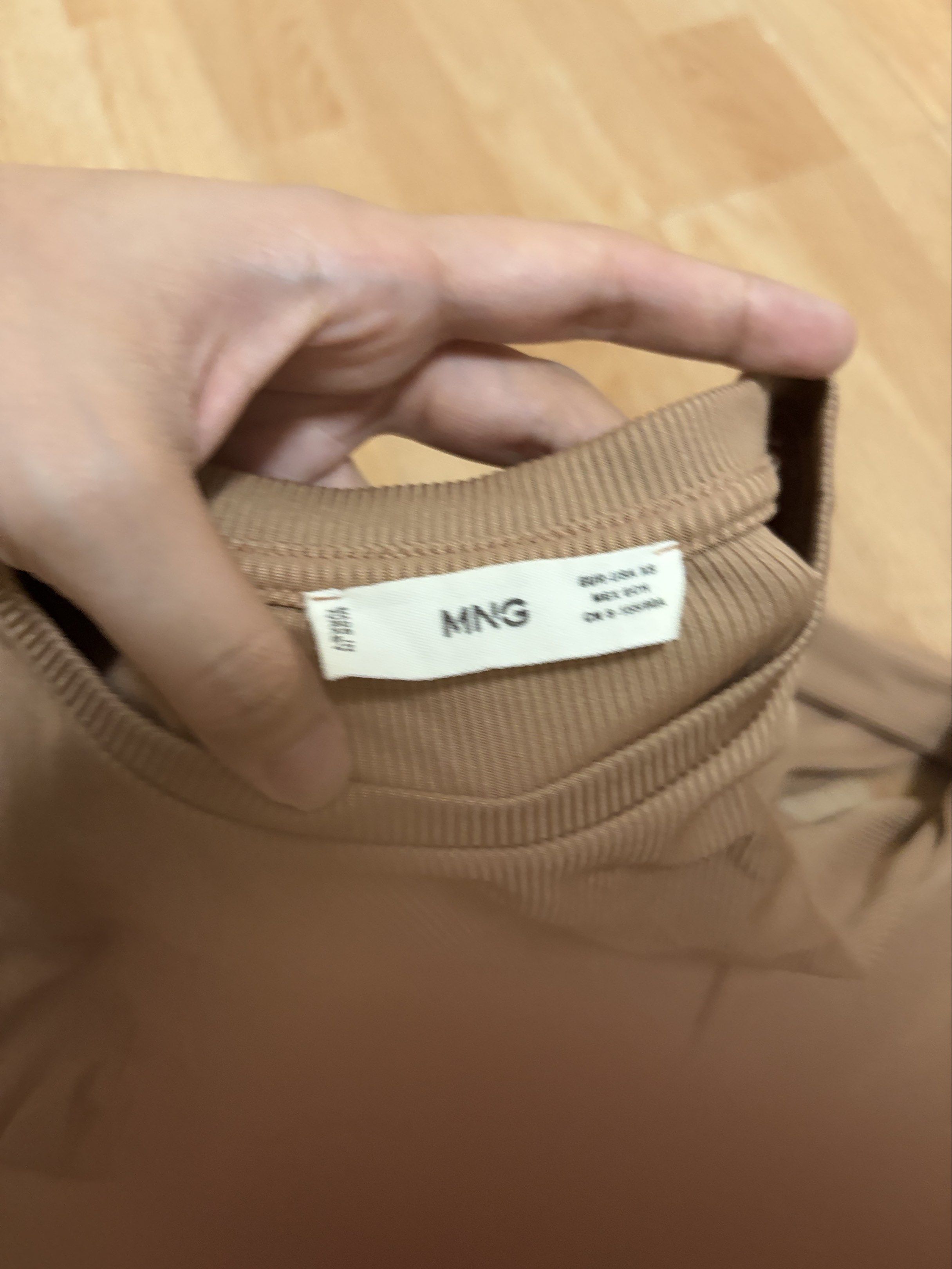 Mango Ribbed Long Sleeve Top (Category: Longsleeves) located in Manila. Submitted by mxnasmbrd (Listing ID 1420730028, Image 2). Description: - Mango ribbed top - Long sleeves - Crew neck - Neutral brown color - Size tag visible - Versatile wardrobe piece.