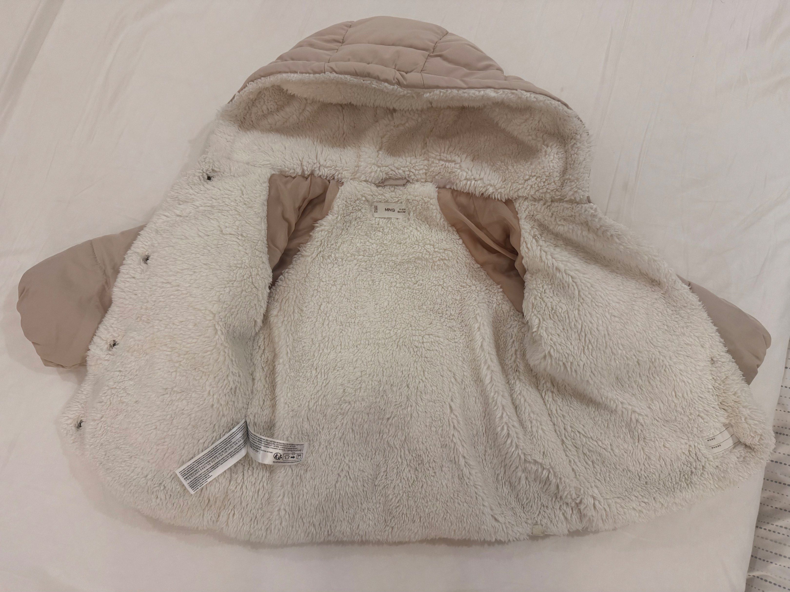 MNG Baby Padded Jacket with Hood (Category: Coats, Jackets and Outerwear) located in Pasay City. Submitted by kengdecluter (Listing ID 1420660133, Image 2). Description: - MNG baby jacket - Size: 12-18 months (86cm) - Padded design - Cozy sherpa-lined interior - Hooded - Button-up front - Two pockets - Neutral beige color.