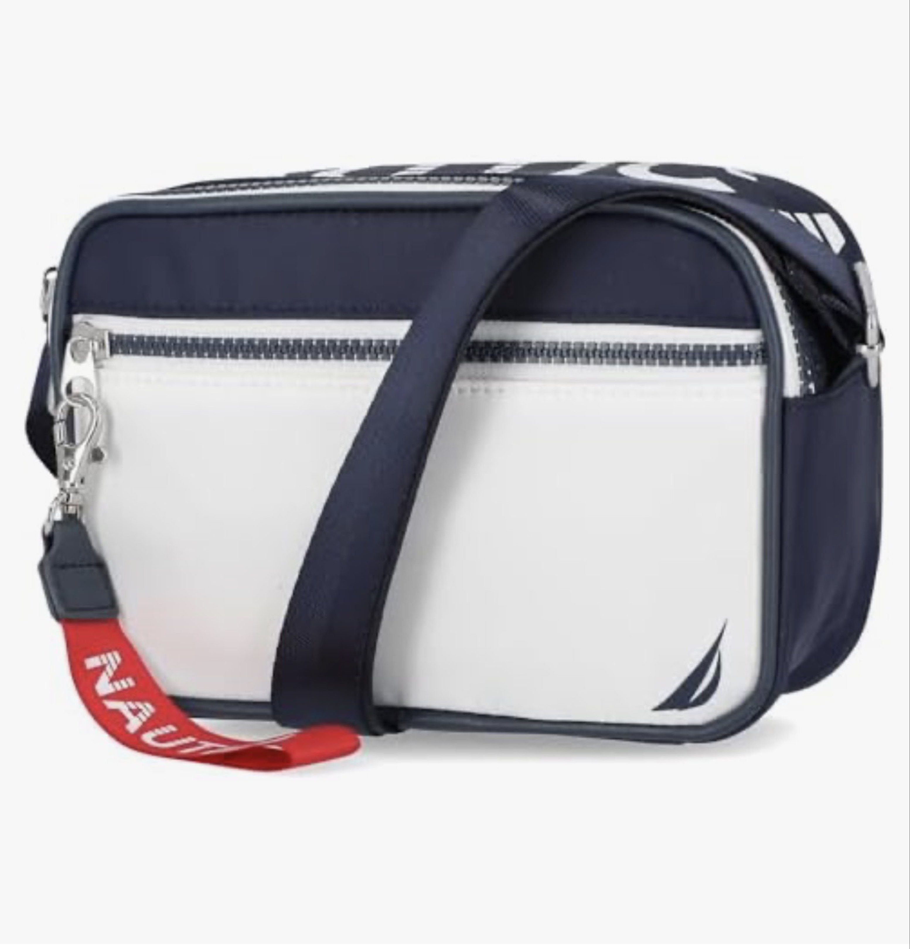Nautica High Seas Crossbody Bag (Category: Cross-body Bags) located in Manila. Submitted by luxestuffph (Listing ID 1420600521, Image 2). Description: - Purchased in US - Brand new - On-hand PH - Navy and white color scheme - Main compartment - Adjustable shoulder strap - Zipper closure - Red Nautica tag - Compact and stylish design Material composition PU leather -Care instructions Hand wash only, Avoid machine wash, Do not iron, Store in a cool