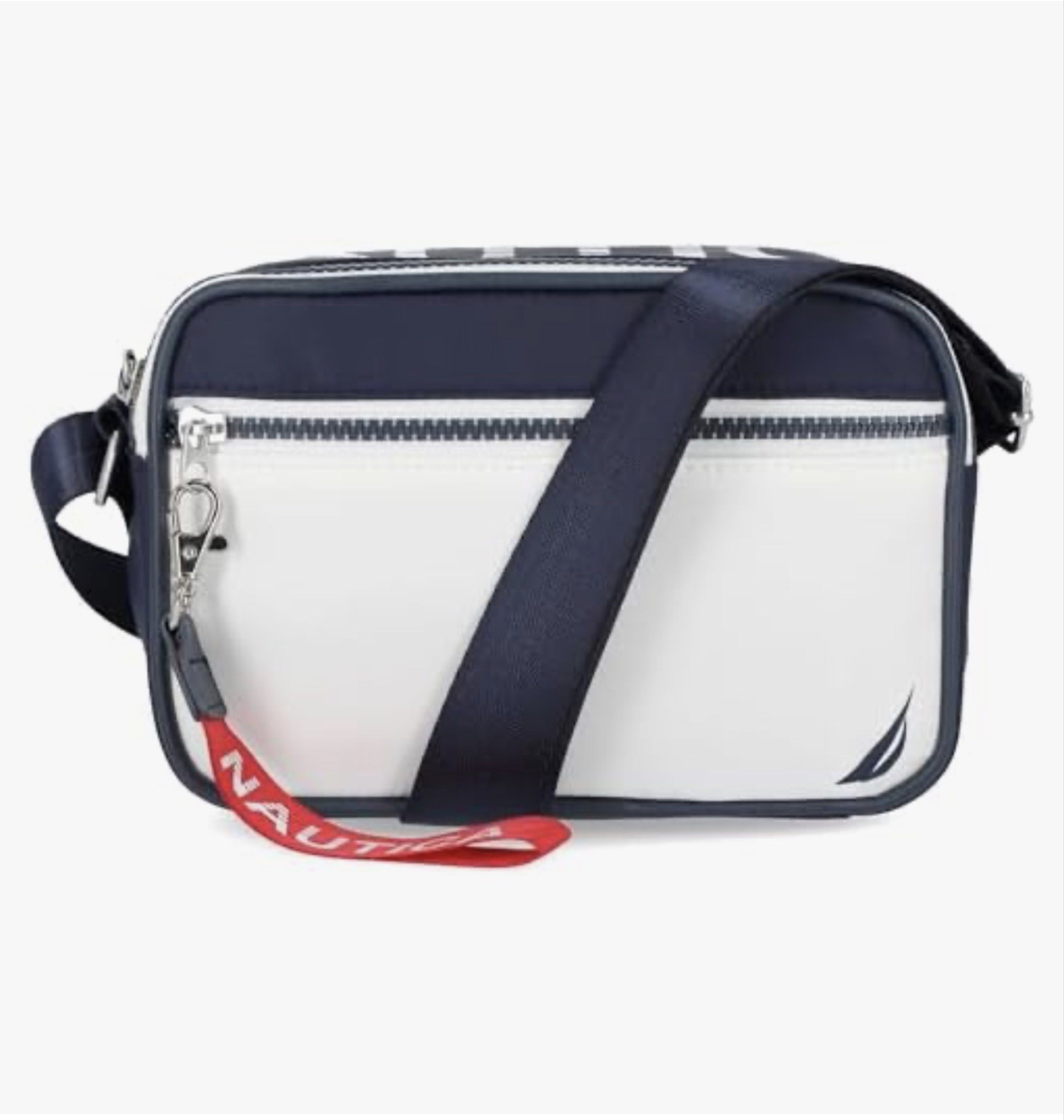 Nautica High Seas Crossbody Bag (Category: Cross-body Bags) located in Manila. Submitted by luxestuffph (Listing ID 1420600521, Image 1). Description: - Purchased in US - Brand new - On-hand PH - Navy and white color scheme - Main compartment - Adjustable shoulder strap - Zipper closure - Red Nautica tag - Compact and stylish design Material composition PU leather -Care instructions Hand wash only, Avoid machine wash, Do not iron, Store in a cool