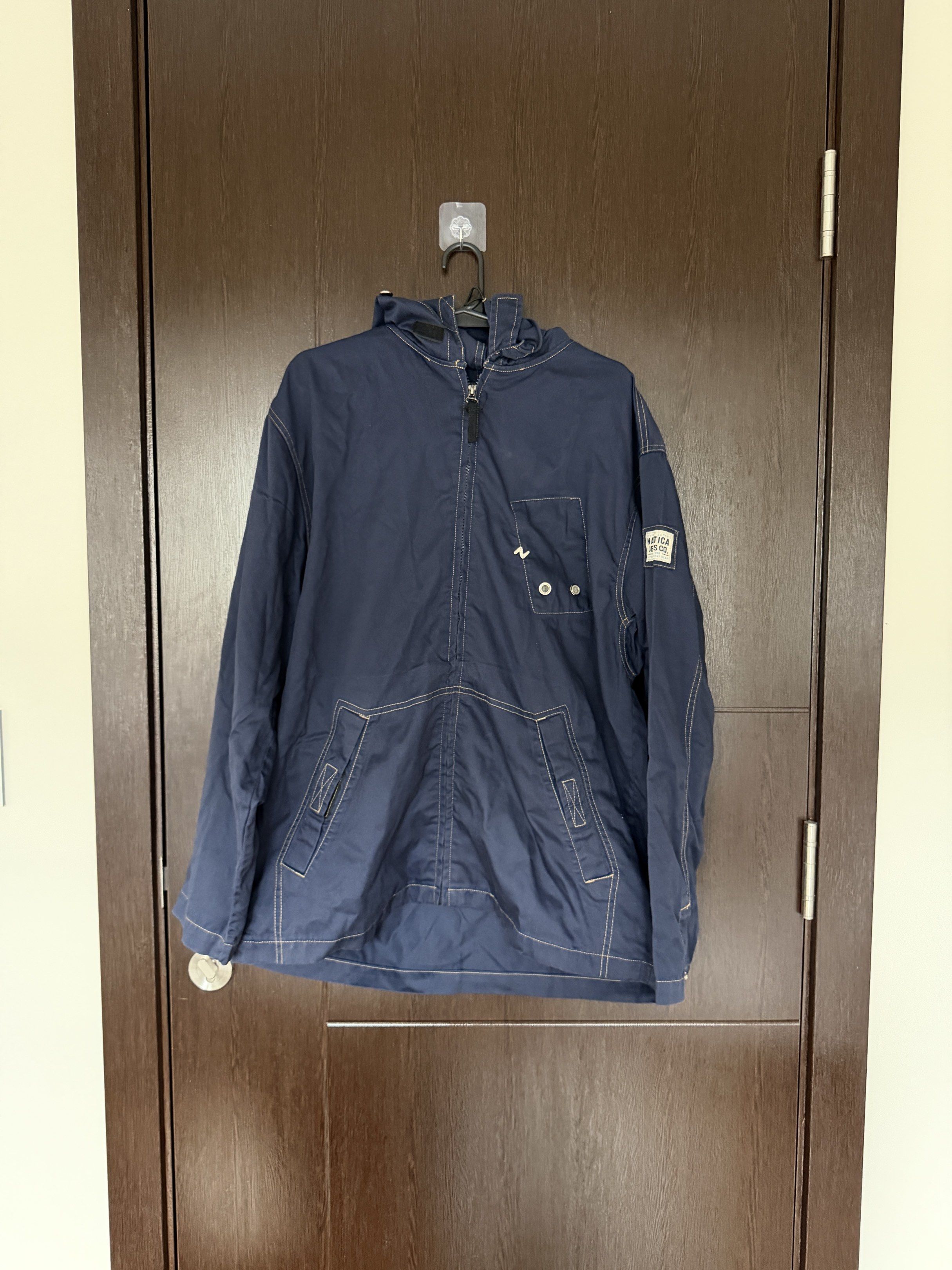 Nautica Jeans Company Jacket - Large (Category: Coats, Jackets and Outerwear) located in Taguig. Submitted by 77dbae (Listing ID 1420573372, Image 1). Description: Nautica Jeans Company jacket with hood - authentic - Color: Navy blue - Size: L - Features: Hood, front zipper, two front pockets - Details: Nautica Jeans Company logo patch on sleeve.