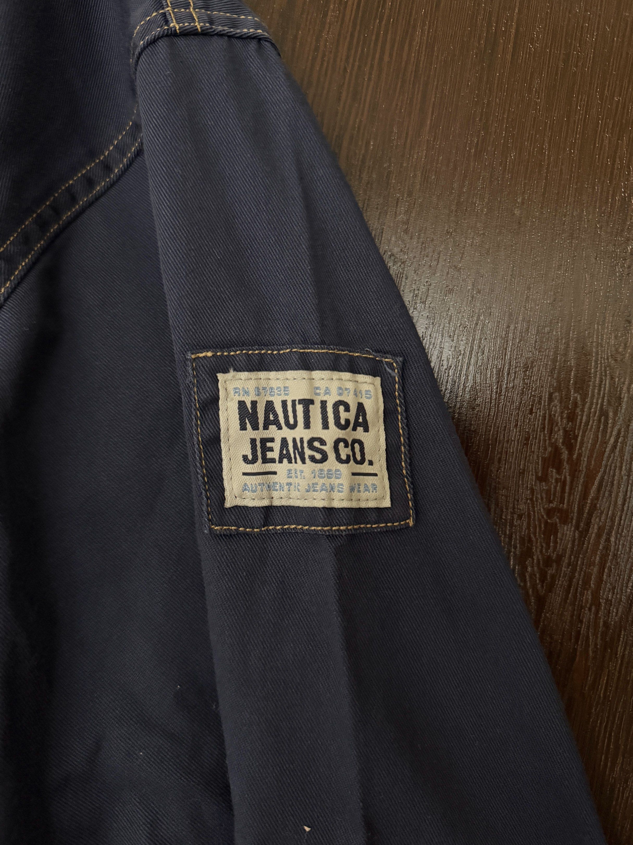 Nautica Jeans Company Jacket - Large (Category: Coats, Jackets and Outerwear) located in Taguig. Submitted by 77dbae (Listing ID 1420573372, Image 3). Description: Nautica Jeans Company jacket with hood - authentic - Color: Navy blue - Size: L - Features: Hood, front zipper, two front pockets - Details: Nautica Jeans Company logo patch on sleeve.