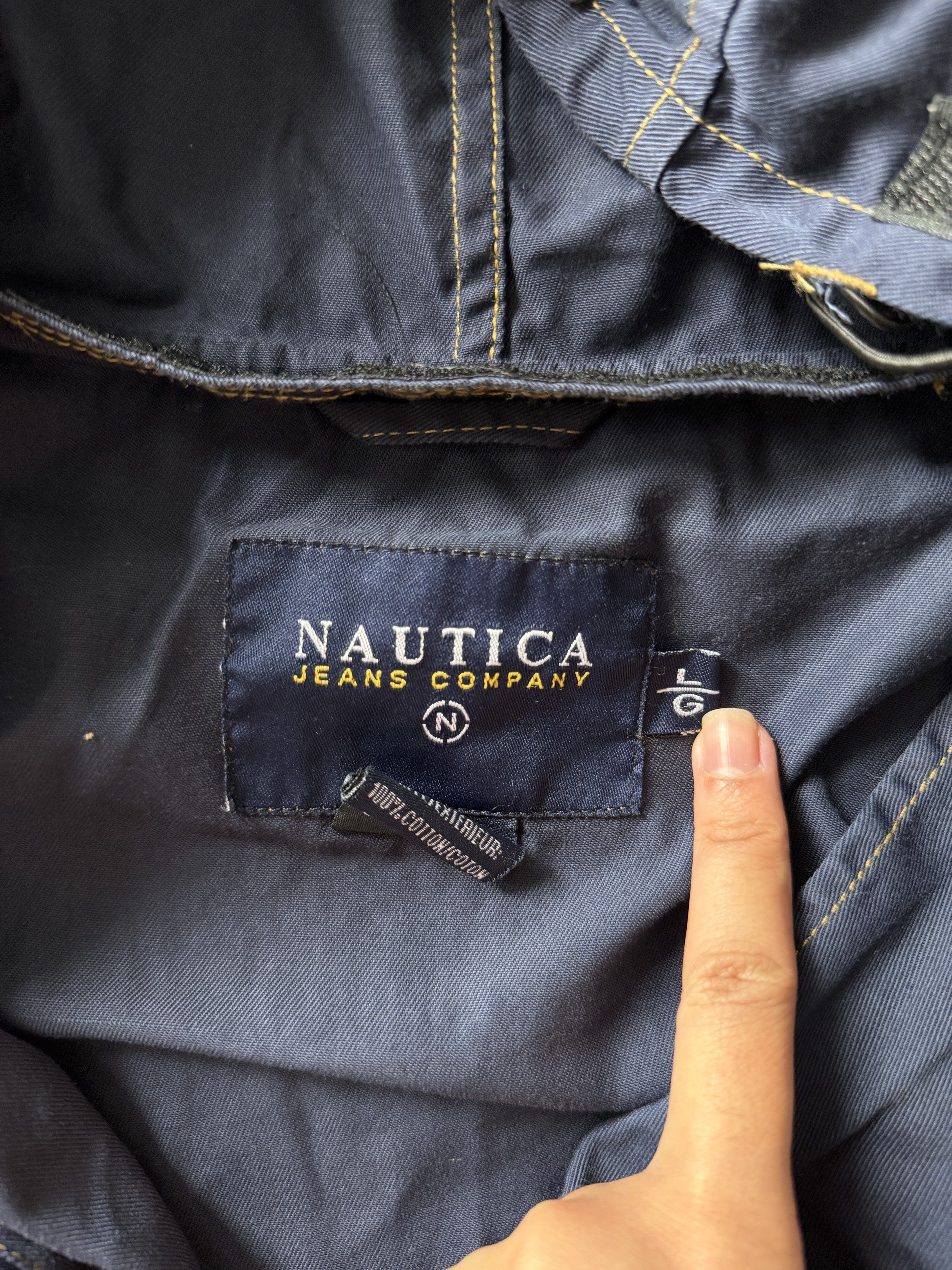 Nautica Jeans Company Jacket - Large (Category: Coats, Jackets and Outerwear) located in Taguig. Submitted by 77dbae (Listing ID 1420573372, Image 2). Description: Nautica Jeans Company jacket with hood - authentic - Color: Navy blue - Size: L - Features: Hood, front zipper, two front pockets - Details: Nautica Jeans Company logo patch on sleeve.