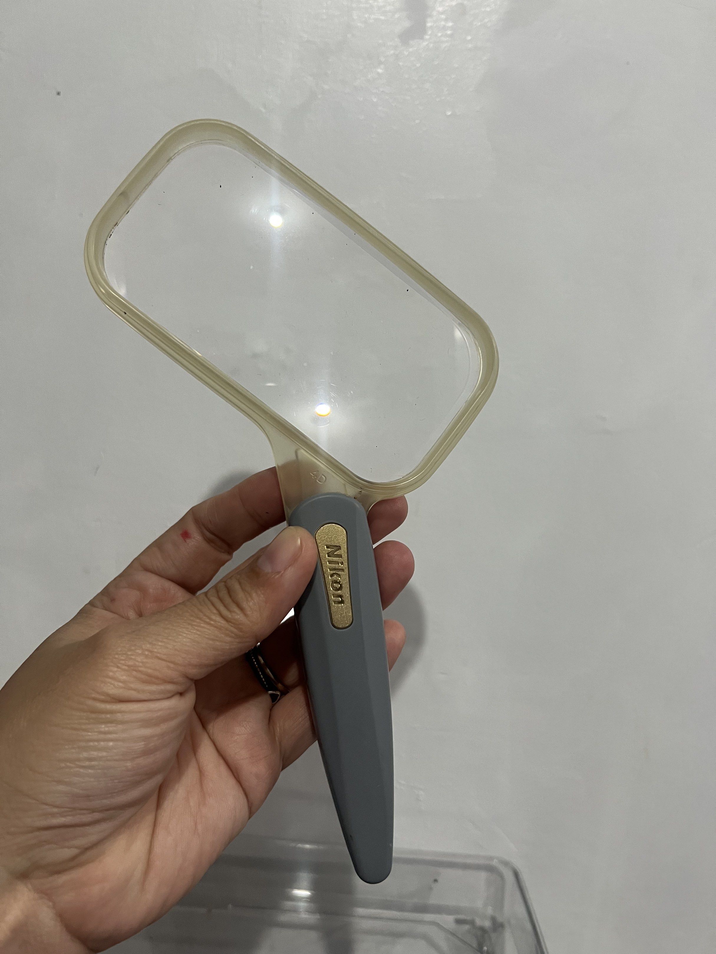 Nikon 4D XM RECTANGULAR LOUPE (Category: Lens & Kits) located in Bacoor. Submitted by faith.hope.love28 (Listing ID 1420572229, Image 3). Description: - Nikon magnifying glass - Gray handle - Clear rectangular lens - Gold Nikon logo - 'MADE IN JAPAN' marking - '4D XM' lens marking.