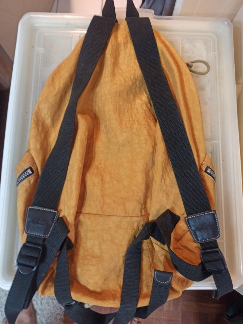 Original Kipling Orange Small Backpack (Category: Backpacks) located in Caloocan City. Submitted by rtarellano (Listing ID 1420586145, Image 2). Description: - Orange Kipling backpack - Drawstring closure - Zippered pockets - Adjustable straps - Small front pocket with Kipling logo - Black straps and accents - Kipling branded zipper pulls - Lightweight, possibly nylon material.