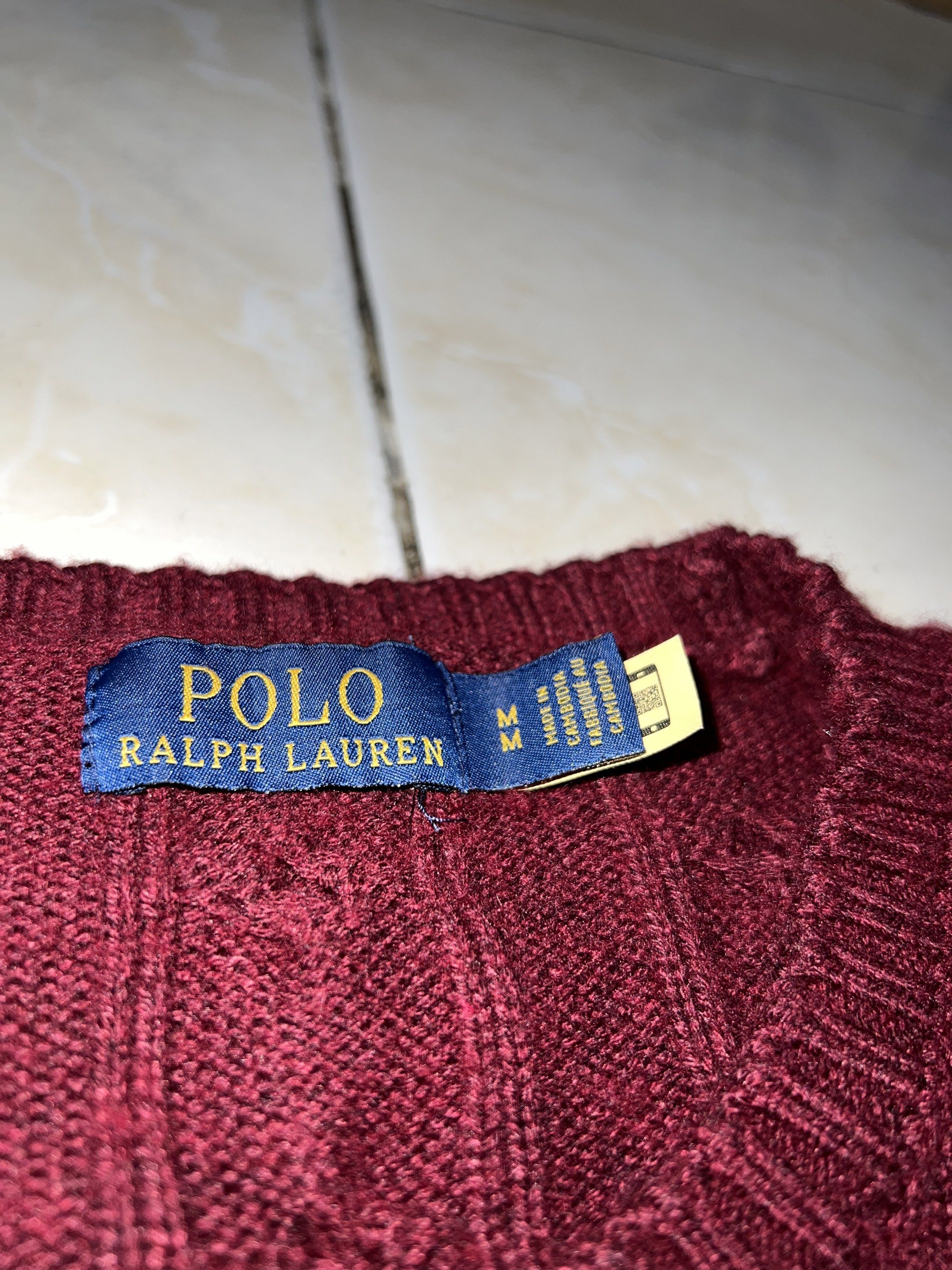 Polo Ralph Lauren Cable Knit Sweater (Category: Coats, Jackets and Outerwear) located in Baguio. Submitted by highlandselections (Listing ID 1420658170, Image 2). Description: - Polo Ralph Lauren cable knit sweater - Color: Maroon - Size: M - Features the iconic Polo logo - Crew neck and long sleeves - Made in Cambodia - Versatile for layering or standalone wear - A classic piece.