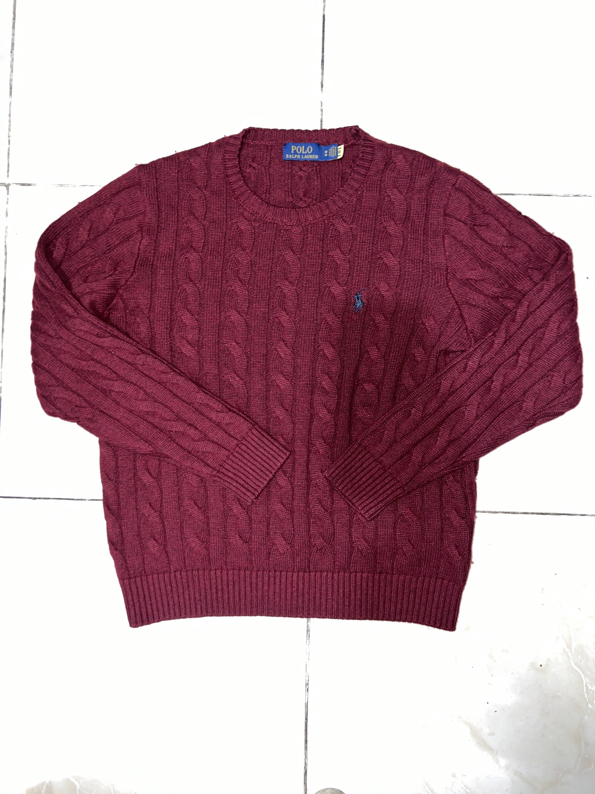 Polo Ralph Lauren Cable Knit Sweater (Category: Coats, Jackets and Outerwear) located in Baguio. Submitted by highlandselections (Listing ID 1420658170, Image 1). Description: - Polo Ralph Lauren cable knit sweater - Color: Maroon - Size: M - Features the iconic Polo logo - Crew neck and long sleeves - Made in Cambodia - Versatile for layering or standalone wear - A classic piece.